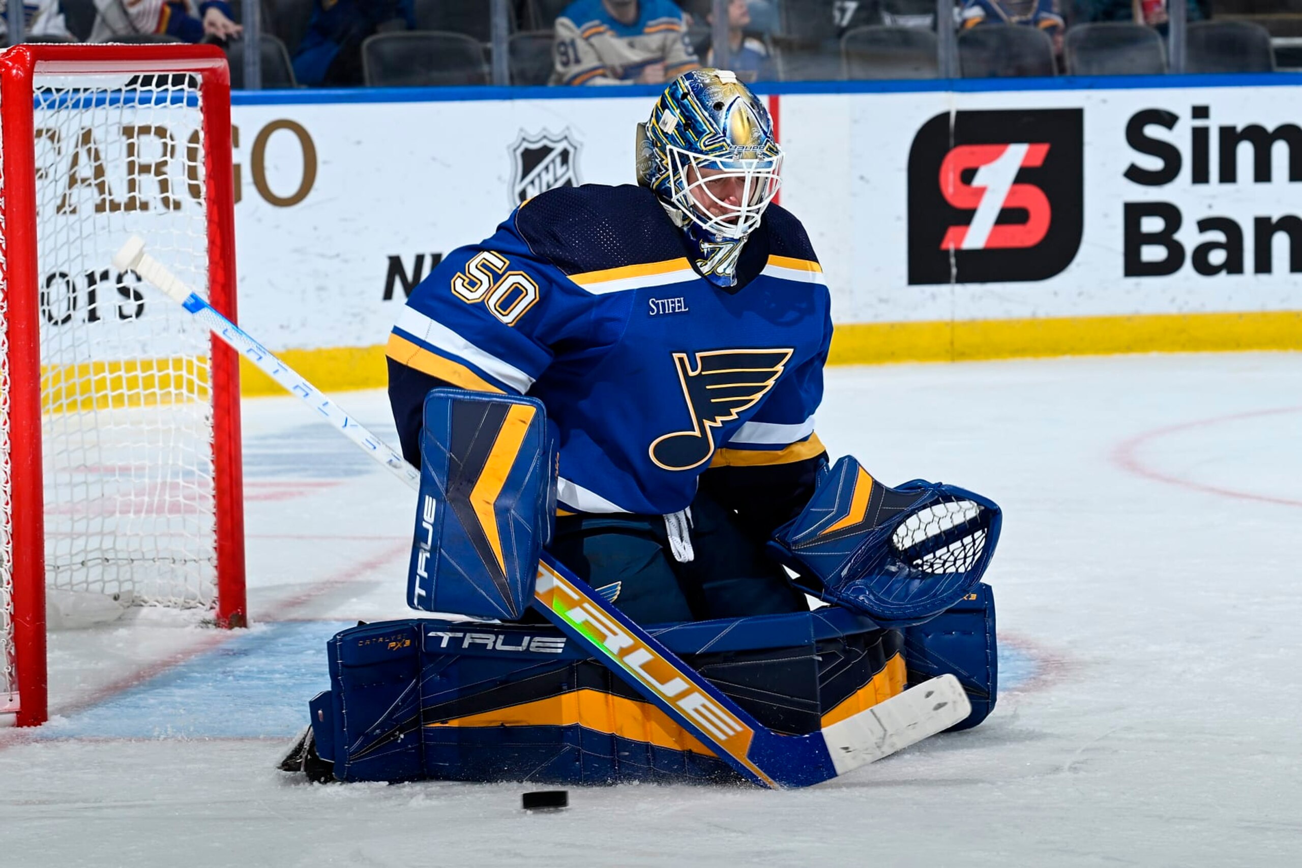 ST. LOUIS, MO - APRIL 6: Jordan Binnington #50 of the St. Louis Blues blocks a shot from the New York Rangers at the Enterprise Center on April 6, 2023 in St. Louis, Missouri. (Photo by Joe Puetz/NHLI via Getty Images)