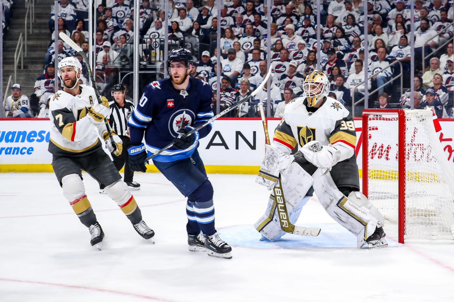 WINNIPEG, CANADA - APRIL 24: Pierre-Luc Dubois #80 of the Winnipeg Jets stands between Alex Pietrangelo #7 and goaltender Laurent Brossoit #39 of the Vegas Golden Knights as they keep an eye on the play during third period action in Game Four of the First Round of the 2023 Stanley Cup Playoffs at the Canada Life Centre on April 24, 2023 in Winnipeg, Manitoba, Canada. The Knights defeated the Jets 4-2 and lead the series 3-1. (Photo by Darcy Finley/NHLI via Getty Images)