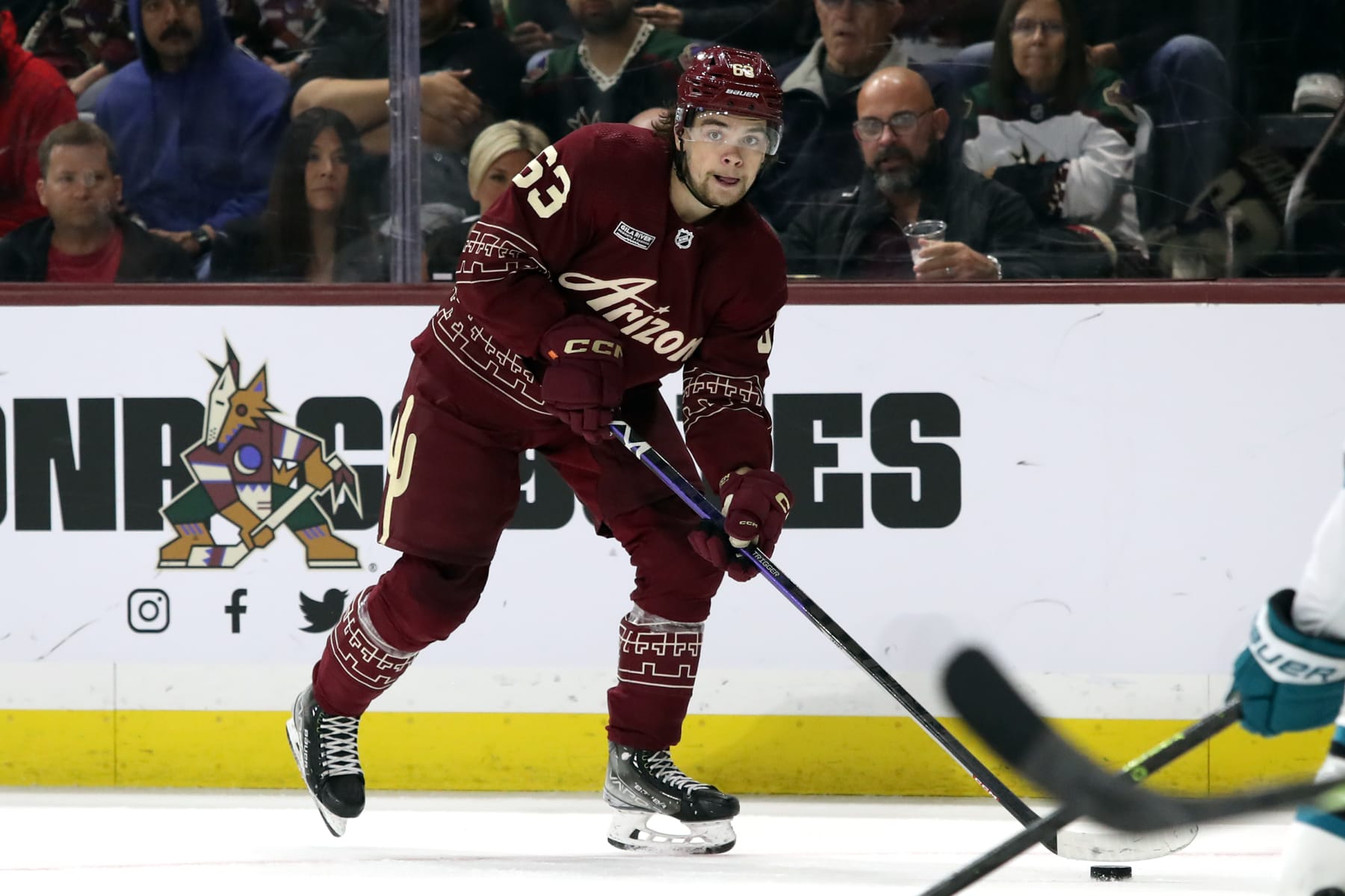 TEMPE, ARIZONA - APRIL 01: Matias Maccelli #63 of the Arizona Coyotes skates with the puck against the San Jose Sharks at Mullett Arena on April 01, 2023 in Tempe, Arizona. (Photo by Zac BonDurant/Getty Images)