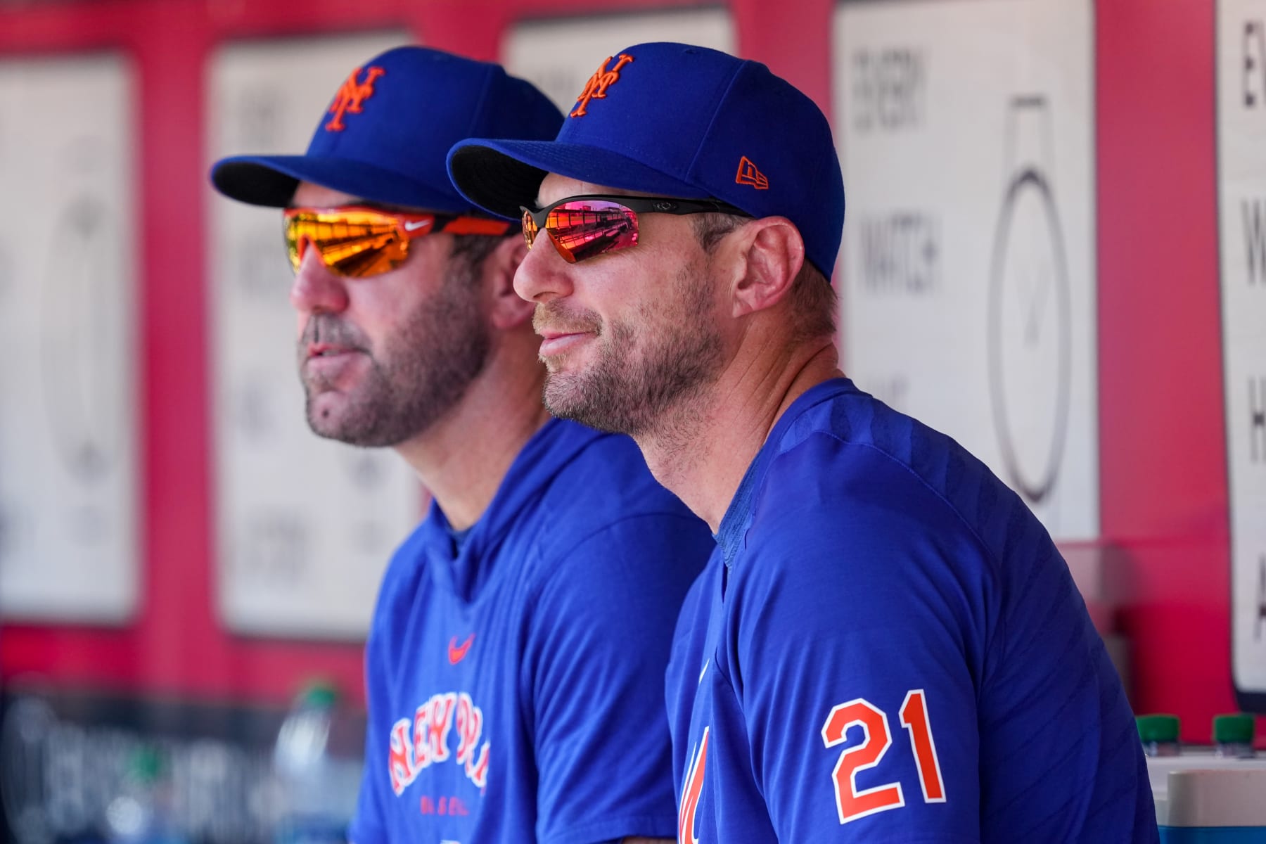 CINCINNATI, OHIO - MAY 11: Justin Verlander #35 (L) and Max Scherzer #21 of the New York Mets look on from the dugout during the game against the Cincinnati Reds at Great American Ball Park on May 11, 2023 in Cincinnati, Ohio. (Photo by Dylan Buell/Getty Images)