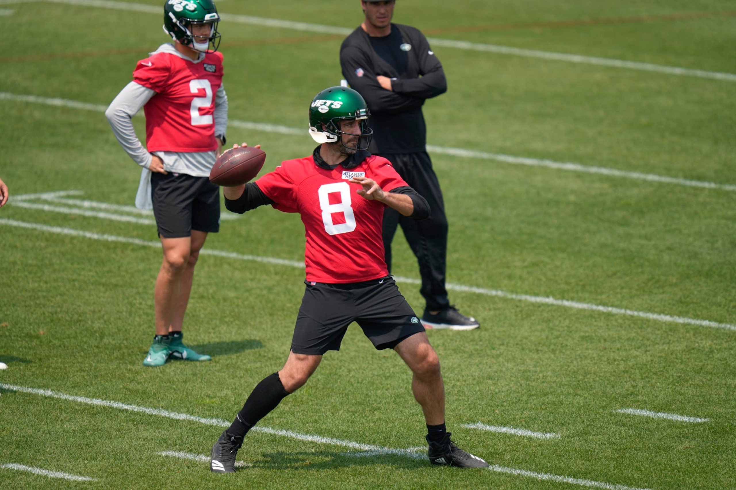 New York Jets quarterback Aaron Rodgers (8) throws during a drill at the NFL football team's training facility in Florham Park, N.J., Tuesday, June 6, 2023. (AP Photo/Seth Wenig)