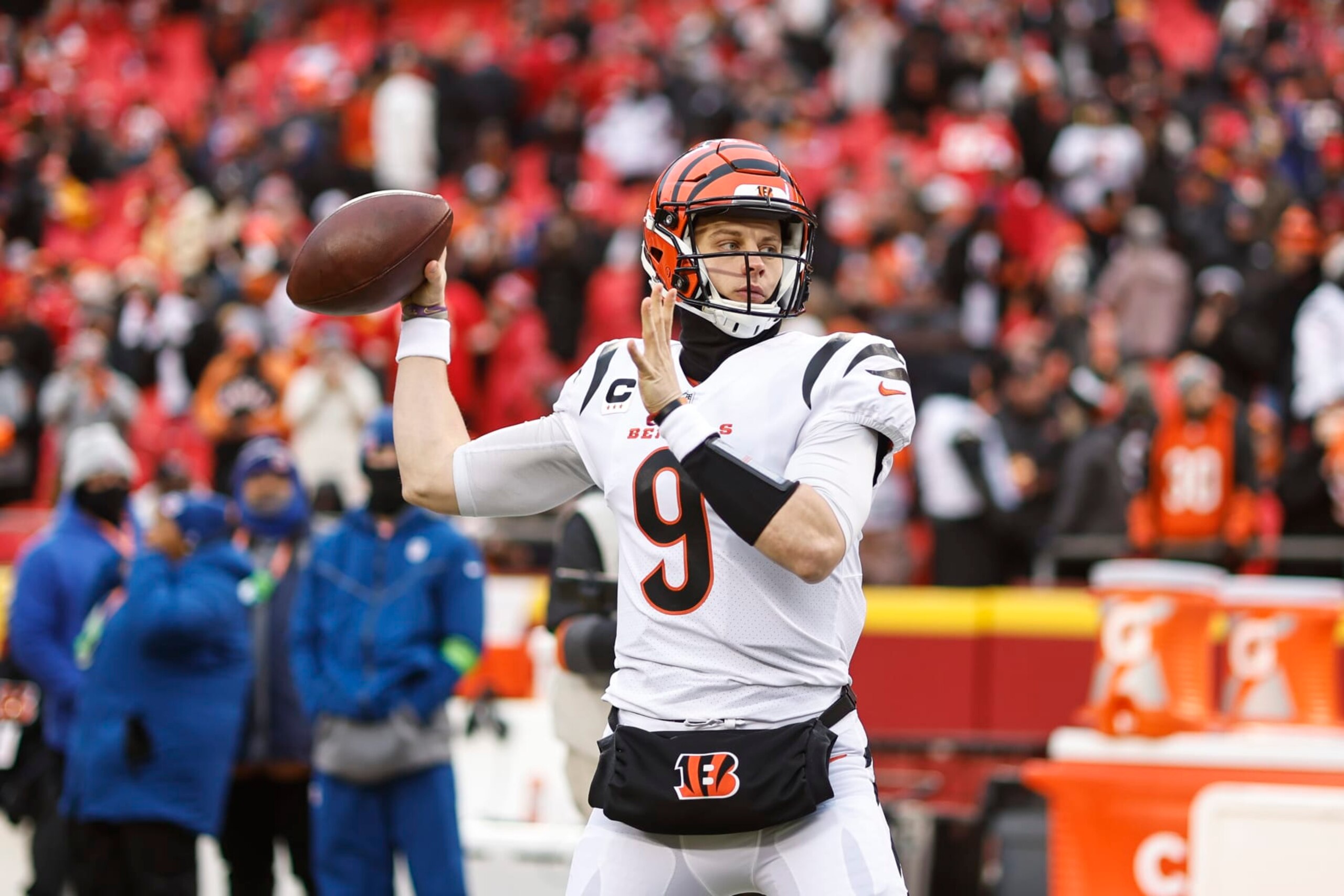 KANSAS CITY, MISSOURI - JANUARY 29: Joe Burrow #9 of the Cincinnati Bengals passes as he warms up prior to the AFC Championship NFL football game between the Kansas City Chiefs and the Cincinnati Bengals at GEHA Field at Arrowhead Stadium on January 29, 2023 in Kansas City, Missouri. (Photo by Michael Owens/Getty Images)