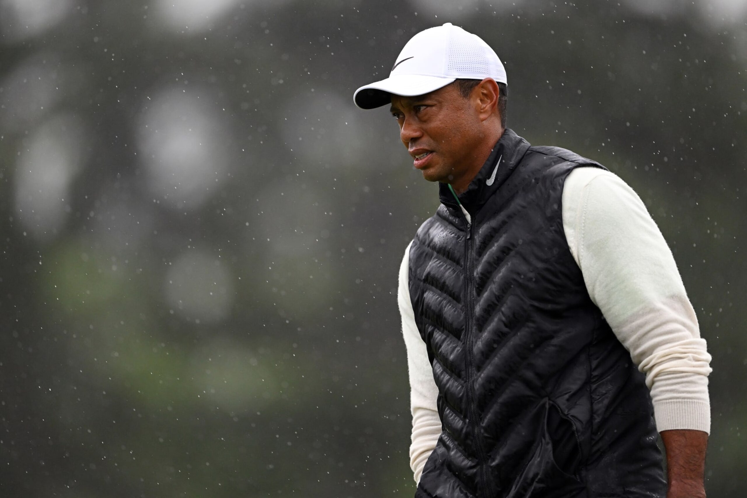 AUGUSTA, GEORGIA - APRIL 08: Tiger Woods of the United States looks on from the 18th green during the continuation of the weather delayed second round of the 2023 Masters Tournament at Augusta National Golf Club on April 08, 2023 in Augusta, Georgia. (Photo by Ross Kinnaird/Getty Images)