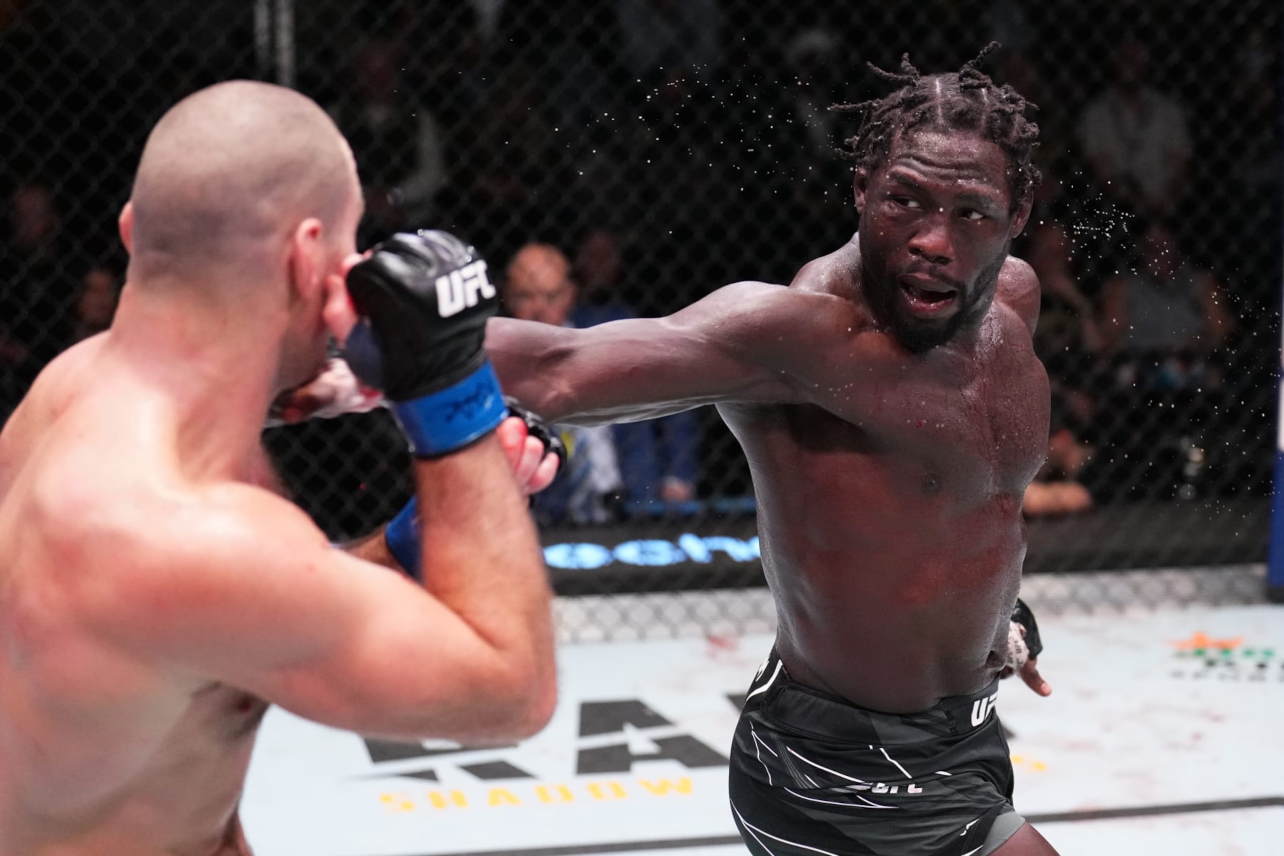 LAS VEGAS, NEVADA - DECEMBER 17: (R-L) Jared Cannonier battles Sean Strickland in a middleweight fight during the UFC Fight Night event at UFC APEX on December 17, 2022 in Las Vegas, Nevada. (Photo by Chris Unger/Zuffa LLC)