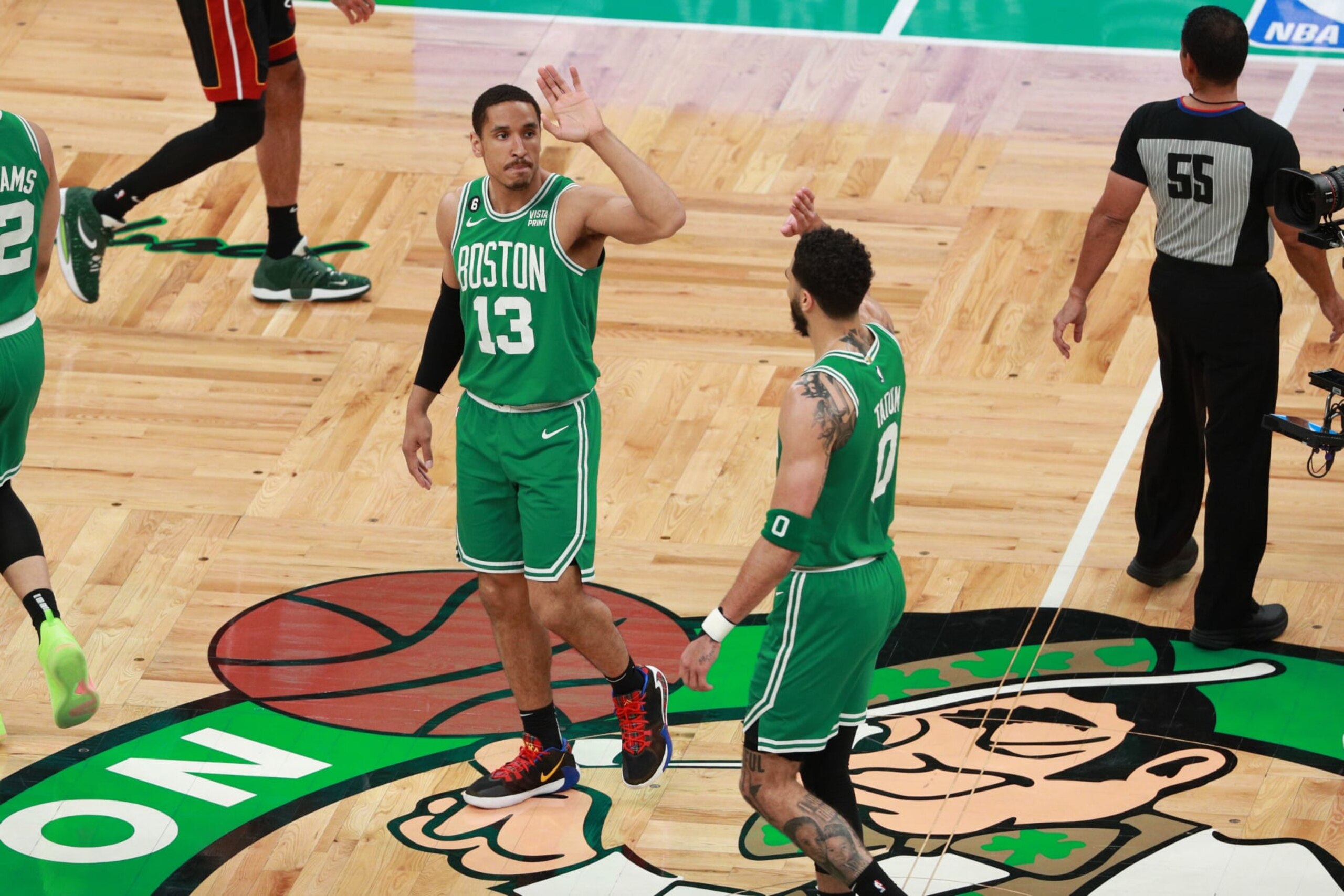 BOSTON, MA - MAY 25: Malcolm Brogdon #13 and Jayson Tatum #0 of the Boston Celtics high five during the game against the Miami Heat during the Eastern Conference Finals of the 2023 NBA Playoffs on May 25, 2023 at the TD Garden in Boston, Massachusetts. NOTE TO USER: User expressly acknowledges and agrees that, by downloading and or using this photograph, User is consenting to the terms and conditions of the Getty Images License Agreement. Mandatory Copyright Notice: Copyright 2023 NBAE  (Photo by Chris Marion/NBAE via Getty Images)