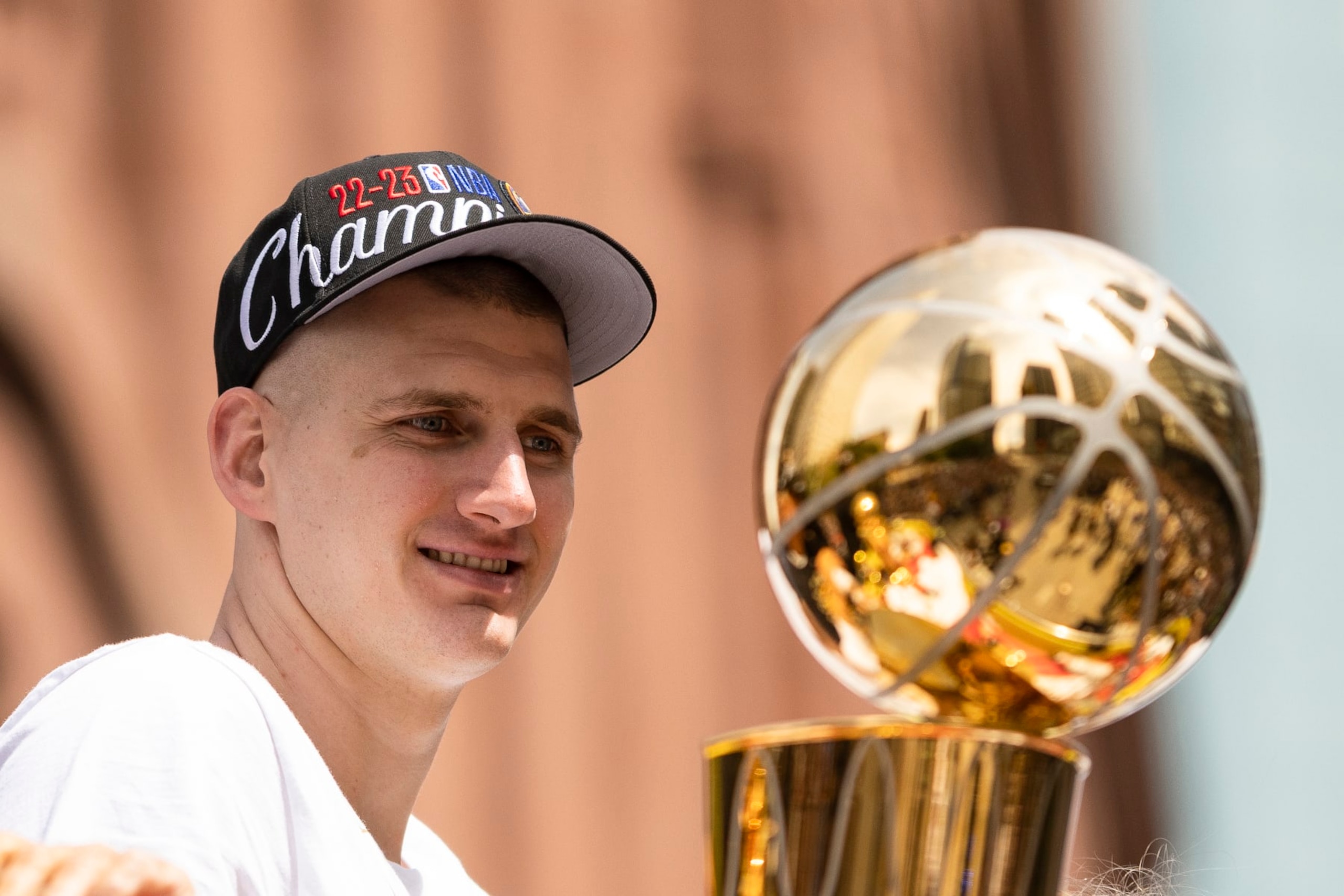 DENVER, CO - JUNE 15: Nikola Jokic #15 of the Denver Nuggets looks on during the 2023 Denver Nuggets Championship Parade on June 15, 2023 in Denver, Colorado. NOTE TO USER: User expressly acknowledges and agrees that, by downloading and/or using this Photograph, user is consenting to the terms and conditions of the Getty Images License Agreement. Mandatory Copyright Notice: Copyright 2023 NBAE (Photo by Ben Swanson/NBAE via Getty Images)