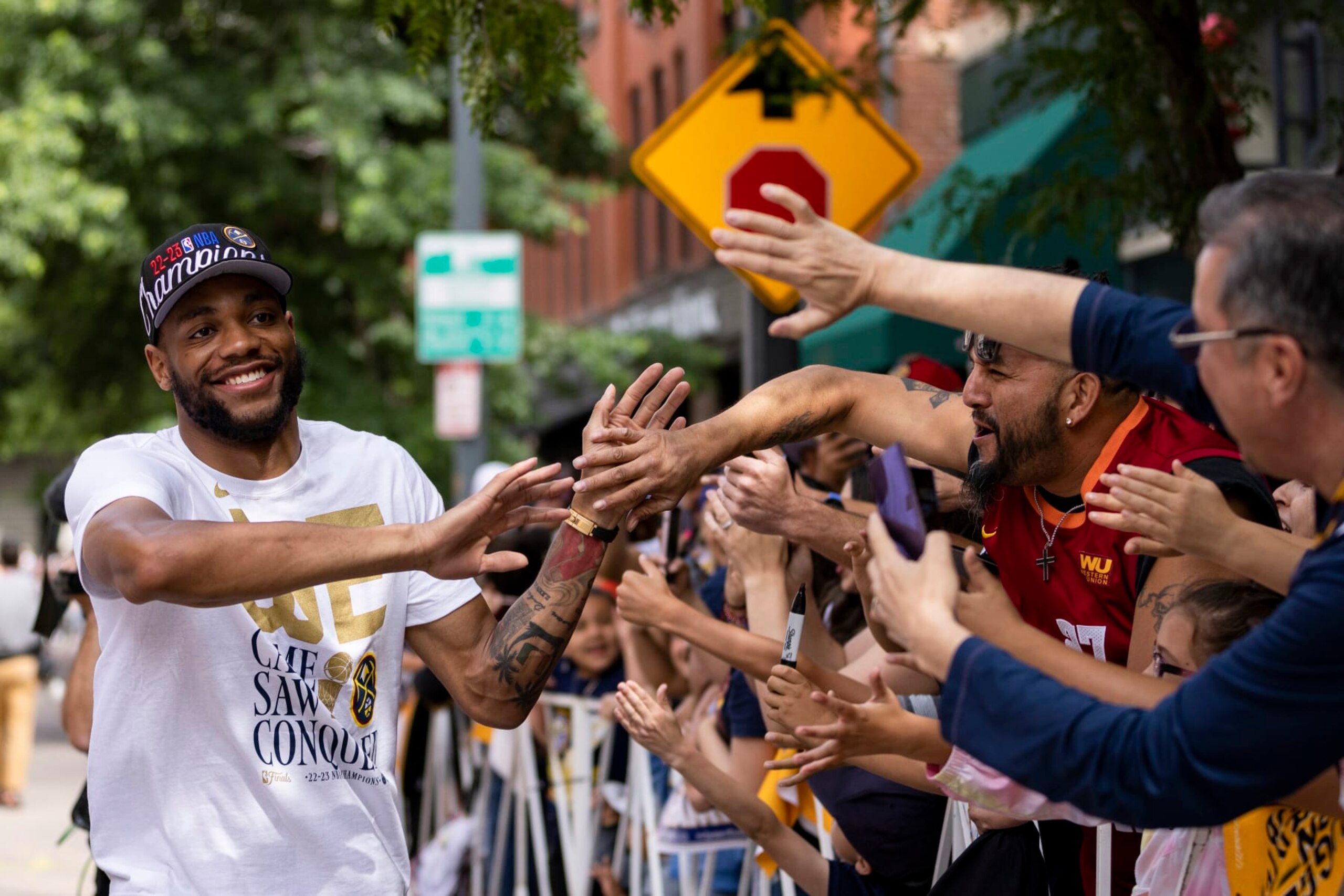 DENVER, CO - JUNE 15: Bruce Brown #11 of the Denver Nuggets celebrates during the 2023 Denver Nuggets Championship Parade on June 15, 2023 in Denver, Colorado. NOTE TO USER: User expressly acknowledges and agrees that, by downloading and/or using this Photograph, user is consenting to the terms and conditions of the Getty Images License Agreement. Mandatory Copyright Notice: Copyright 2023 NBAE (Photo by Ben Swanson/NBAE via Getty Images)