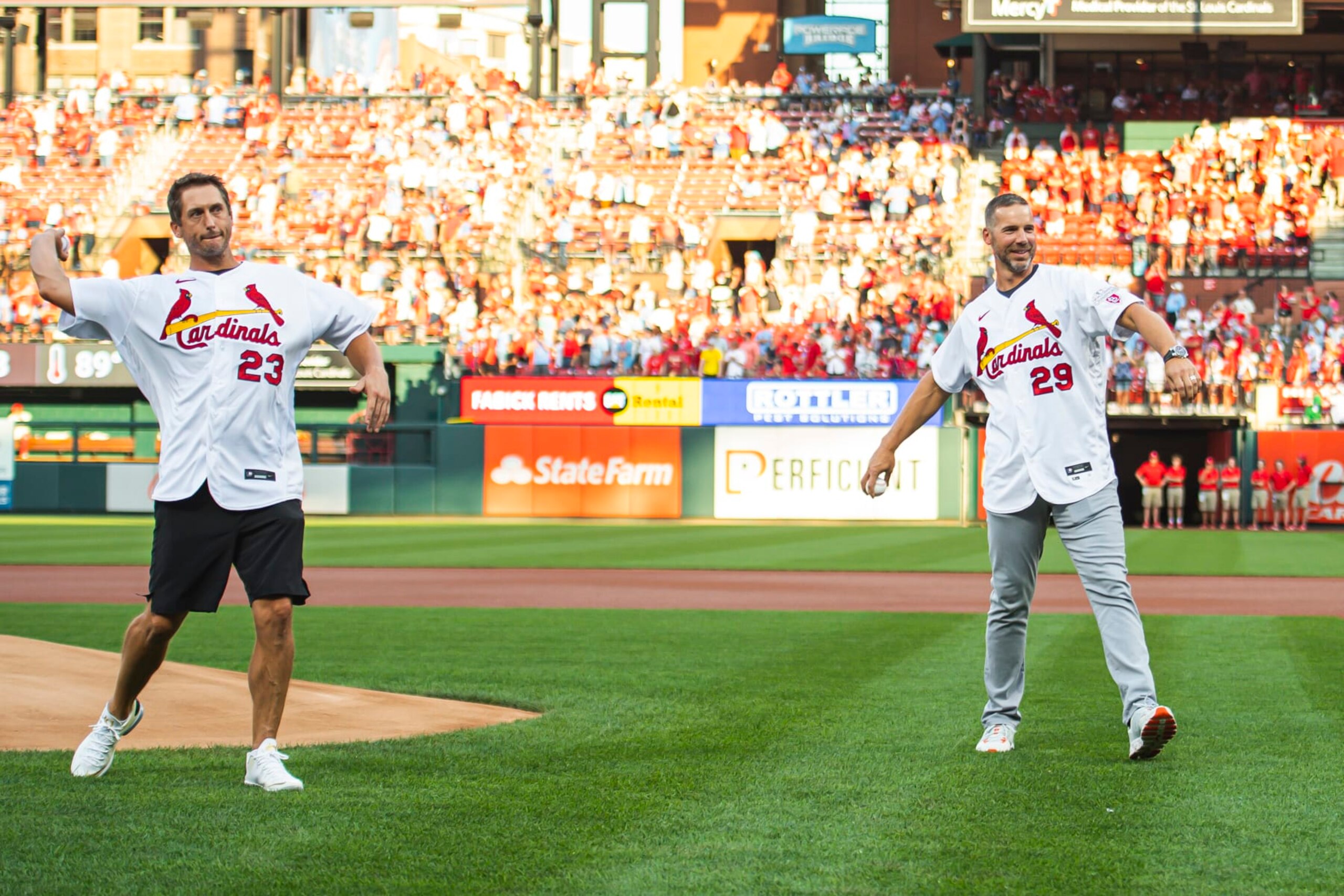 ST. LOUIS, MO - SEPTEMBER 18: Former players David Freese #23 and Chris Carpenter #29, members of the 2011 World Series Champion St. Louis Cardinals, throw out the ceremonial first pitch during the pregame ceremony honoring the 10-year anniversary of their World Series win before the game between the Cardinals and the San Diego Padres at Busch Stadium on September 18, 2021 in St. Louis, Missouri. (Photo by Matt Thomas/San Diego Padres/Getty Images) ST. LOUIS, MO - SEPTEMBER 18: Former players David Freese #23 and Chris Carpenter #29, members of the 2011 World Series Champion St. Louis Cardinals, throw out the ceremonial first pitch during the pregame ceremony honoring the 10-year anniversary of their World Series win before the game between the Cardinals and the San Diego Padres at Busch Stadium on September 18, 2021 in St. Louis, Missouri. (Photo by Matt Thomas/San Diego Padres/Getty Images)