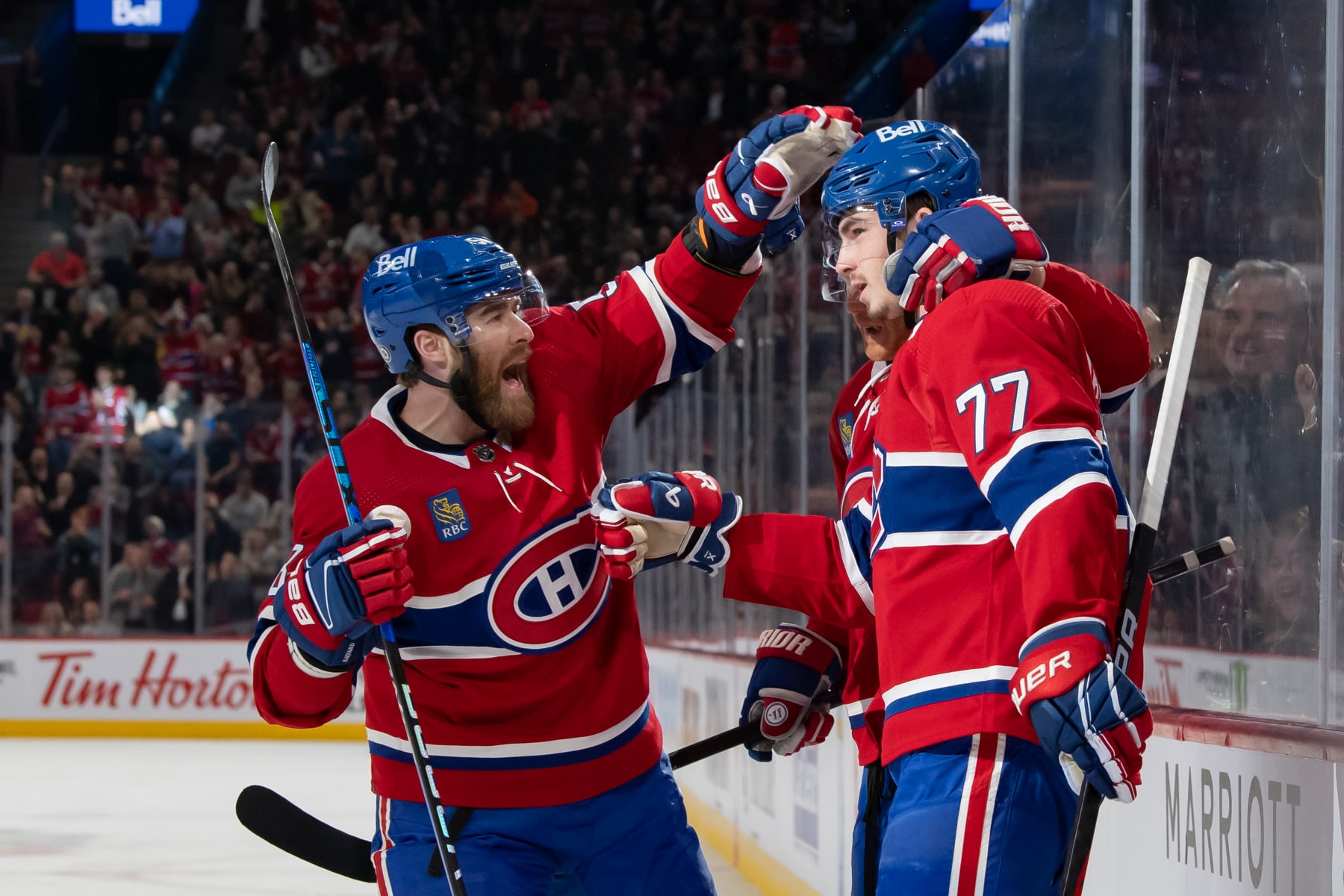 MONTREAL, CANADA - MARCH 21: Kirby Dach #77, Mike Matheson #8 and David Savard #58 of the Montreal Canadiens celebrate after scoring a goal against the Tampa Bay Lightning during the first period in the NHL game at the Centre Bell on March 21, 2023 in Montreal, Quebec, Canada. (Photo by Francois Lacasse/NHLI via Getty Images)
