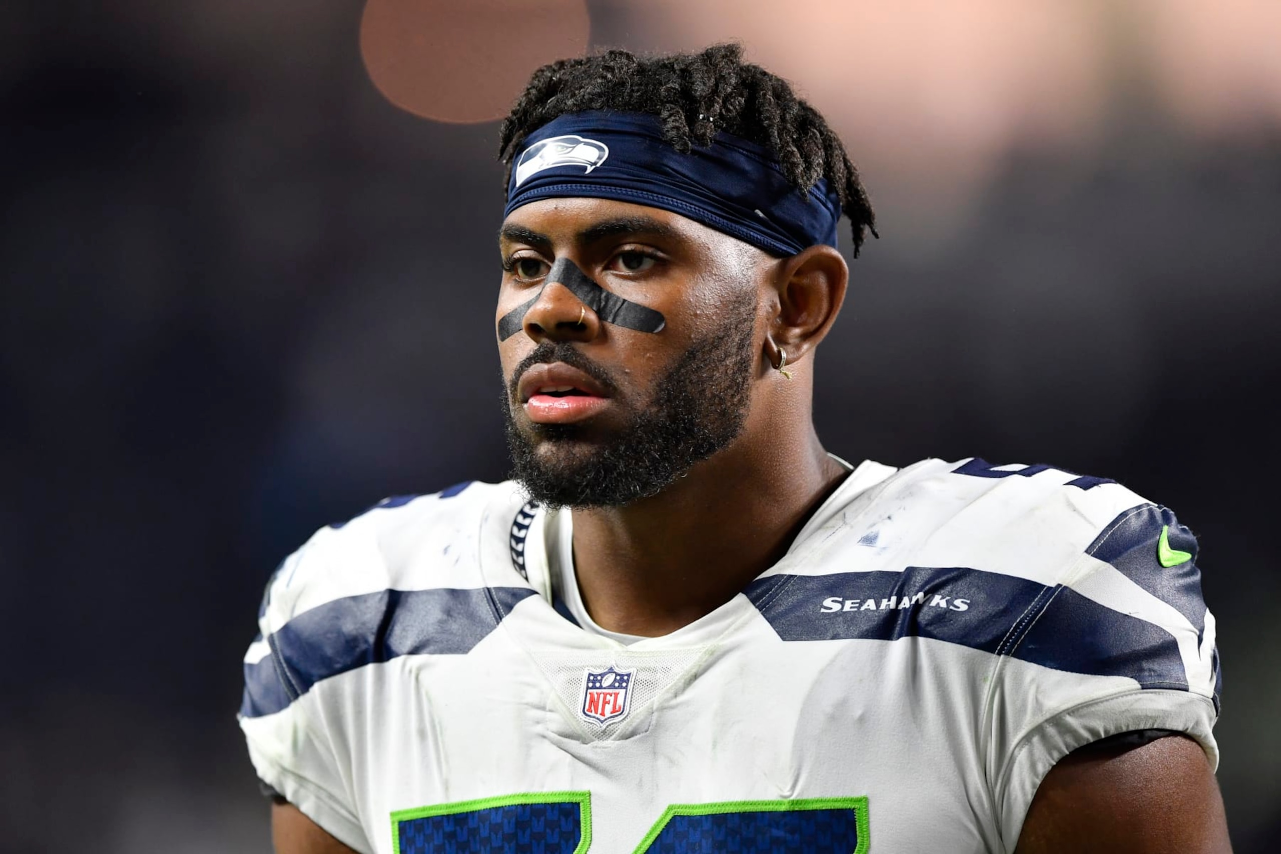 LAS VEGAS, NEVADA - AUGUST 14:  Linebacker Jordyn Brooks #56 of the Seattle Seahawks walks off the field after a preseason game against the Las Vegas Raiders at Allegiant Stadium on August 14, 2021 in Las Vegas, Nevada. The Raiders defeated the Seahawks 20-7. (Photo by Chris Unger/Getty Images)
