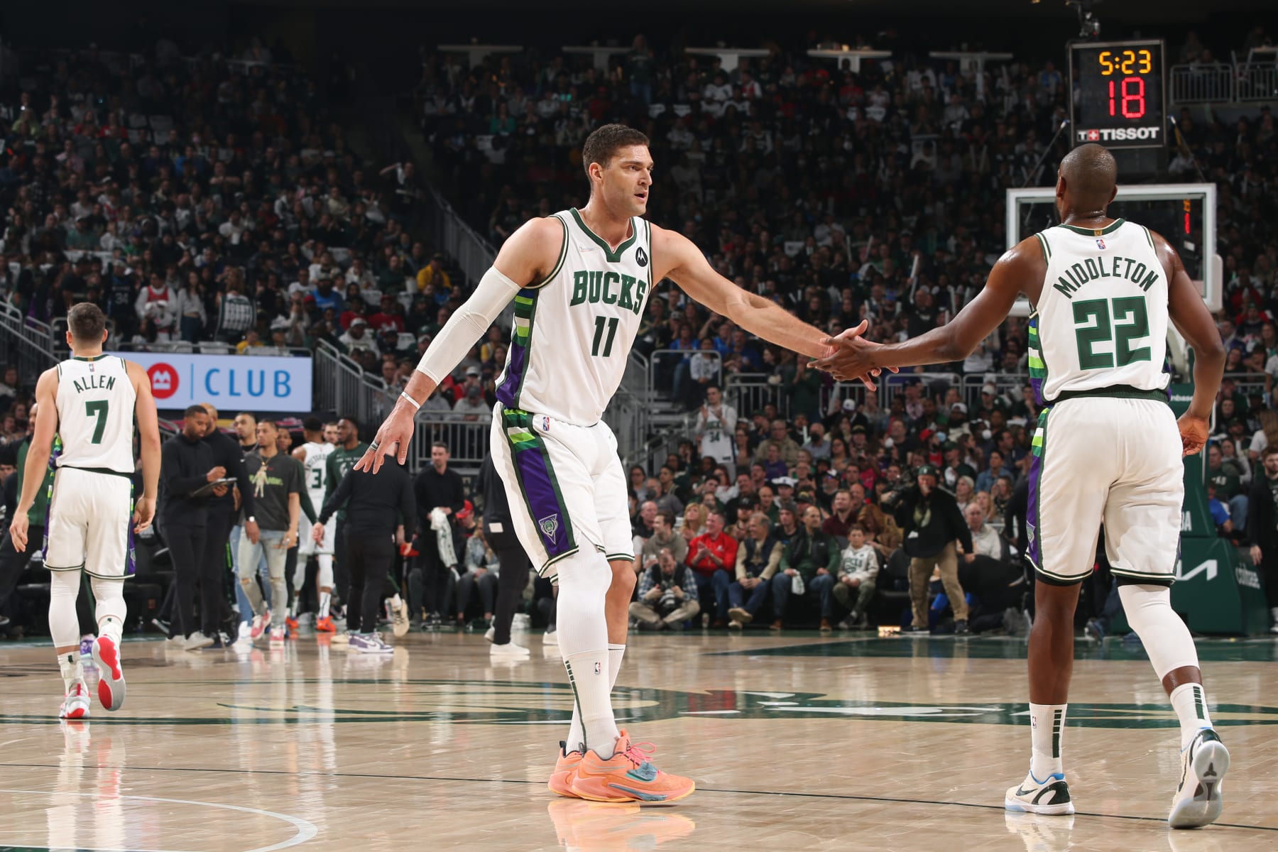 MILWAUKEE, WI - APRIL 17: Brook Lopez #11 and Khris Middleton #22 of the Milwaukee Bucks embrace during Round 1 Game 1 of the 2022 NBA Playoffs on April 17, 2022 at the Fiserv Forum Center in Milwaukee, Wisconsin. NOTE TO USER: User expressly acknowledges and agrees that, by downloading and or using this Photograph, user is consenting to the terms and conditions of the Getty Images License Agreement. Mandatory Copyright Notice: Copyright 2022 NBAE (Photo by Gary Dineen/NBAE via Getty Images).