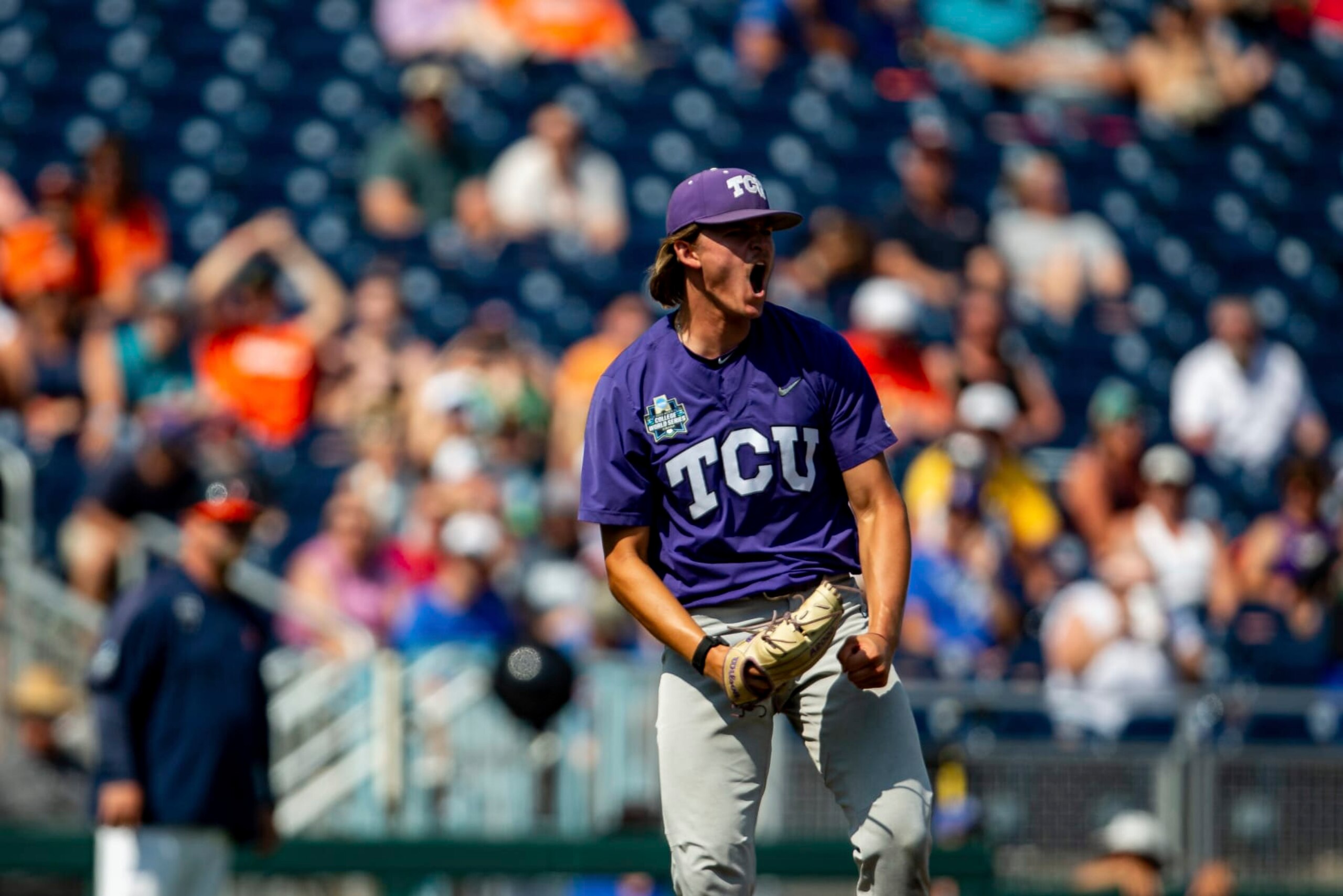 TCU pitcher Ben Abeldt celebrates after a win over Virginia in a baseball game at the NCAA College World Series in Omaha, Neb., Sunday, June 18, 2023. (AP Photo/John Peterson)