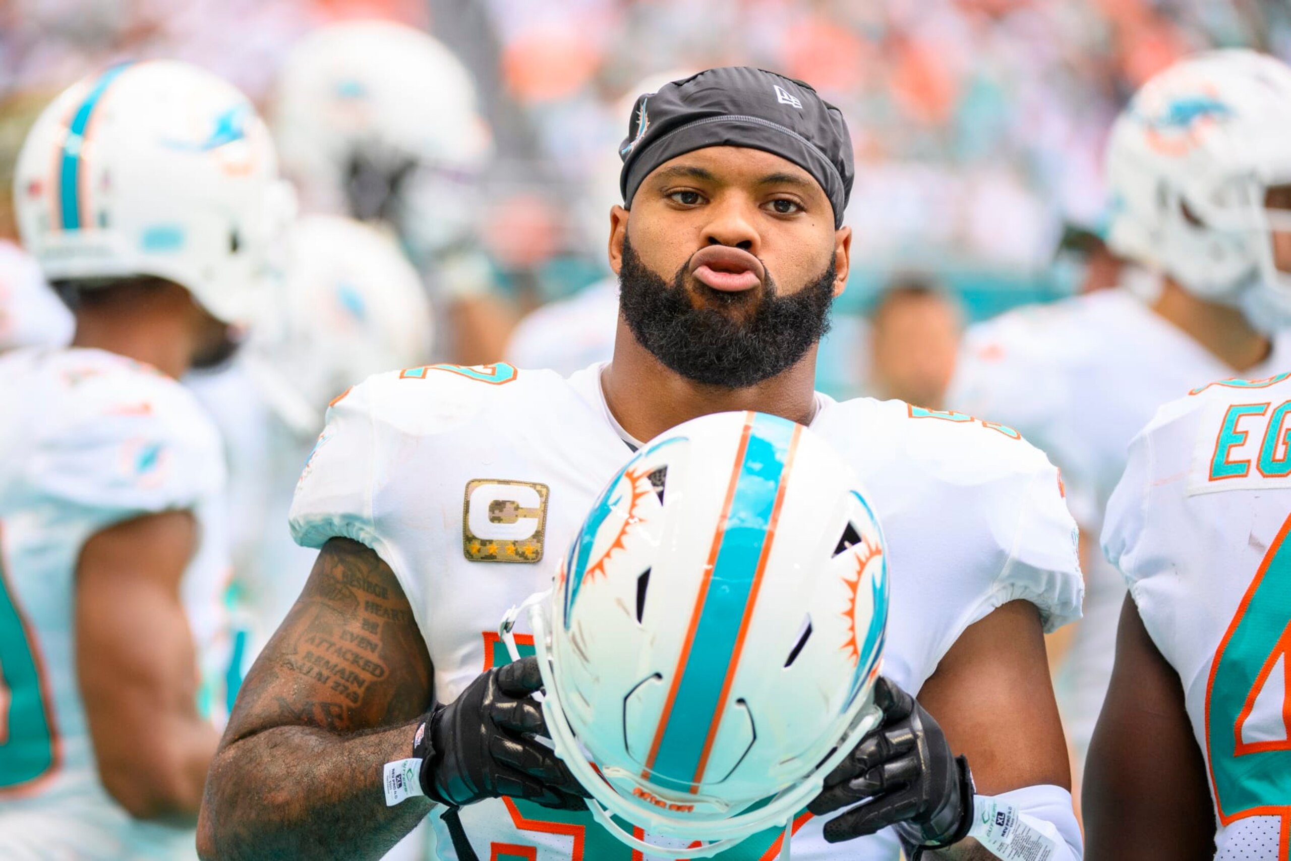 Miami Dolphins linebacker Elandon Roberts (52) walks on the sidelines during an NFL football game against the Cleveland Browns, Sunday, Nov. 13, 2022, in Miami Gardens, Fla. (AP Photo/Doug Murray)