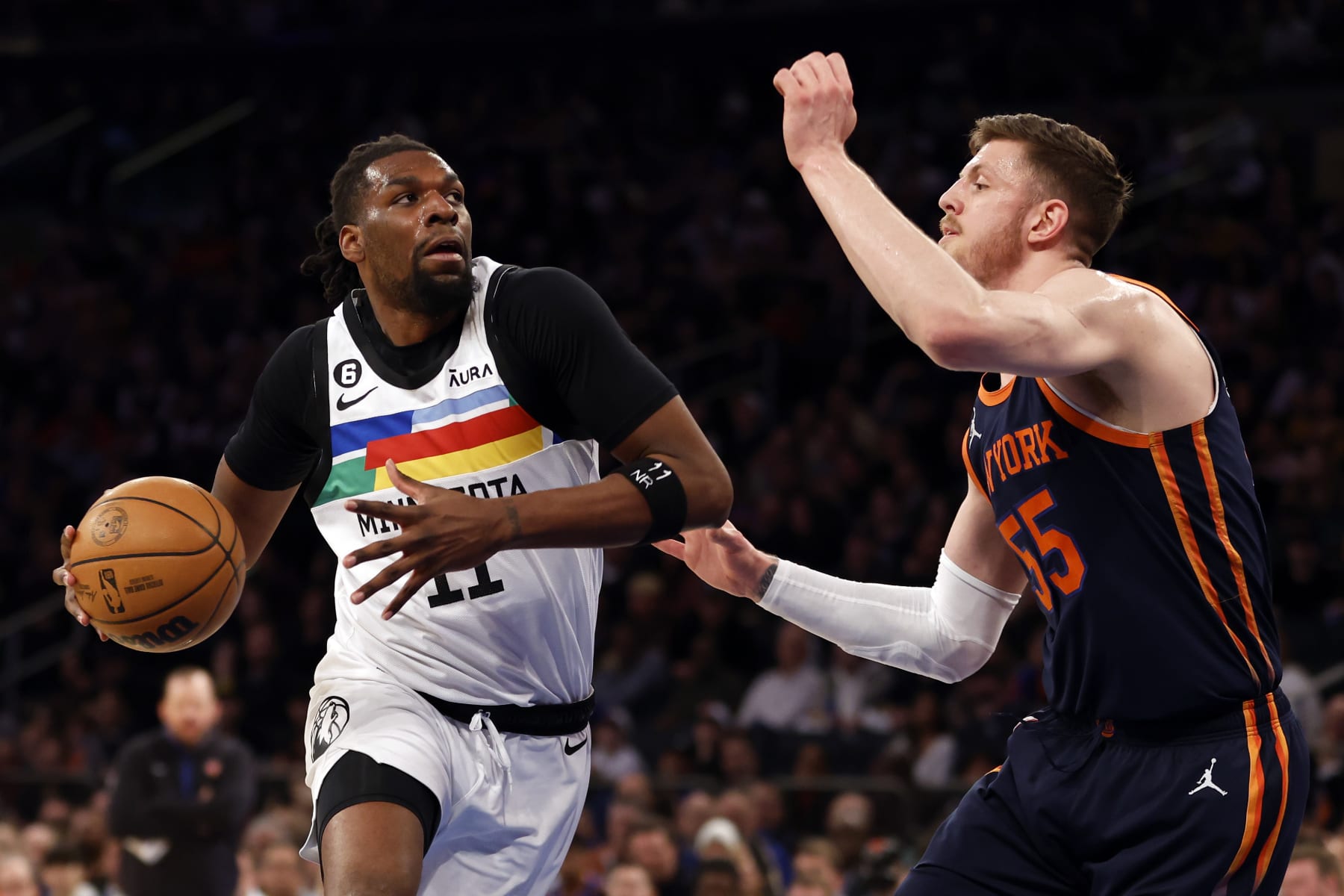 NEW YORK, NEW YORK - MARCH 20: Naz Reid #11 of the Minnesota Timberwolves dribbles against Isaiah Hartenstein #55 of the New York Knicks during the first half at Madison Square Garden on March 20, 2023 in New York City. NOTE TO USER: User expressly acknowledges and agrees that, by downloading and/or using this photograph, User is consenting to the terms and conditions of the Getty Images License Agreement. (Photo by Sarah Stier/Getty Images)