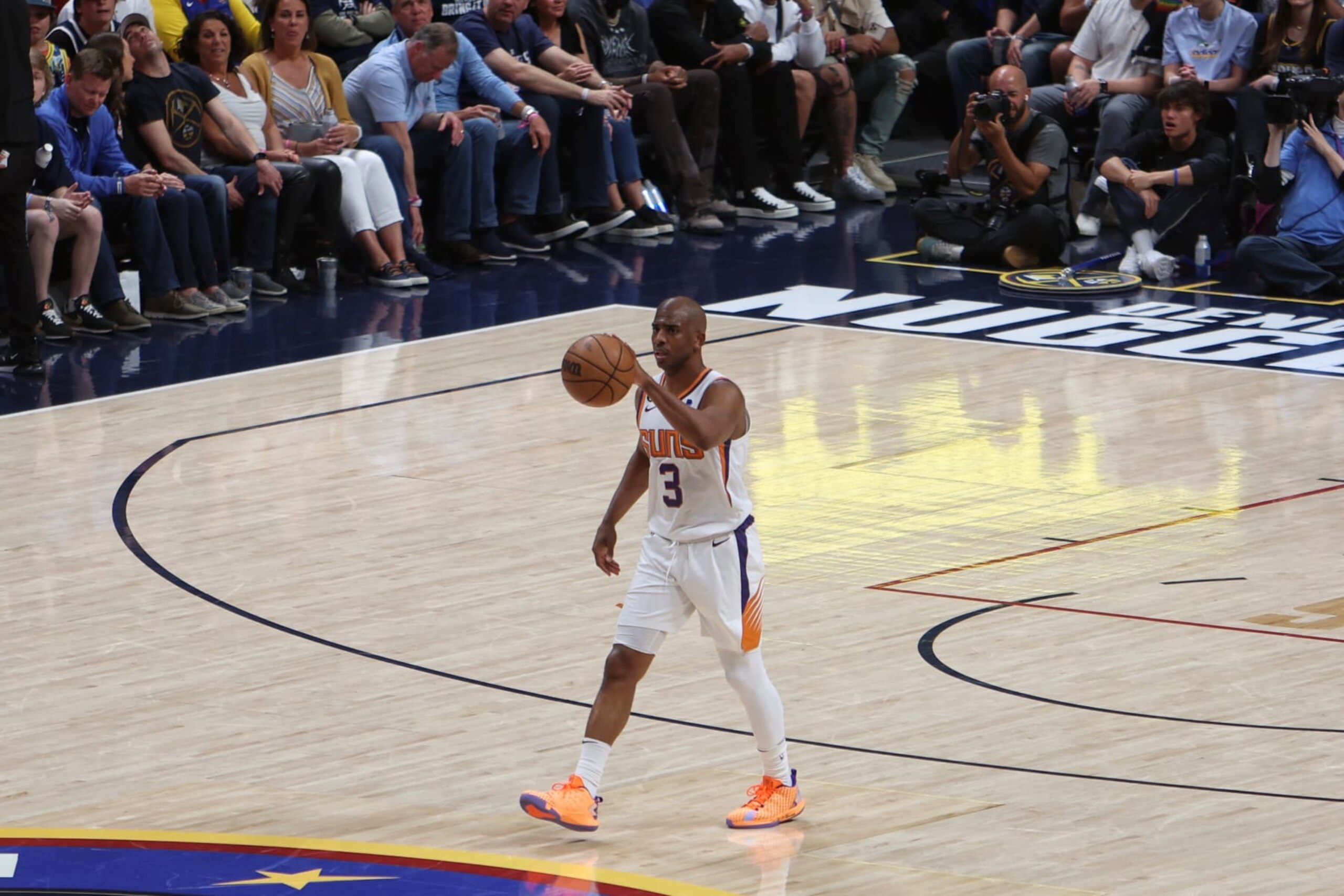 DENVER, CO - APRIL 29: Chris Paul #3 of the Phoenix Suns handles the ball during the game  during round two game one of the 2023 NBA Playoffs on April 29, 2023 at the Ball Arena in Denver, Colorado. NOTE TO USER: User expressly acknowledges and agrees that, by downloading and/or using this Photograph, user is consenting to the terms and conditions of the Getty Images License Agreement. Mandatory Copyright Notice: Copyright 2023 NBAE (Photo by Jim Poorten/NBAE via Getty Images)