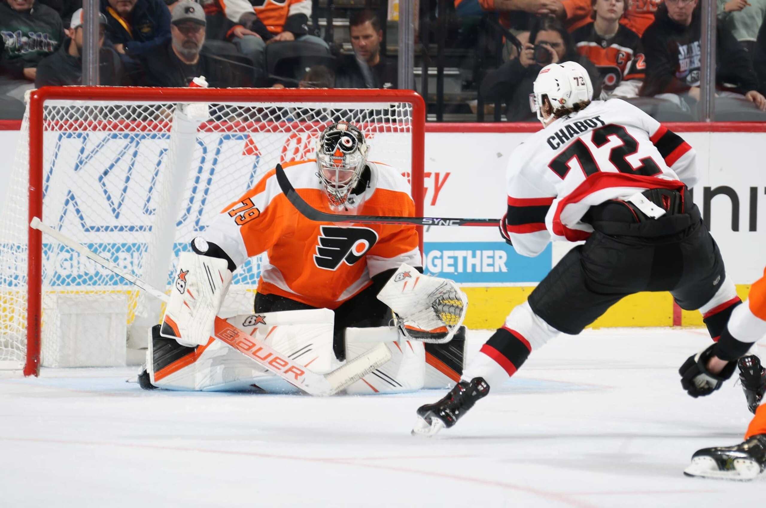PHILADELPHIA, PENNSYLVANIA - NOVEMBER 12: Thomas Chabot #72 of the Ottawa Senators attempts a scoring chance against Carter Hart #79 of the Philadelphia Flyers at the Wells Fargo Center on November 12, 2022 in Philadelphia, Pennsylvania. Chabot would score on the play.  (Photo by Len Redkoles/NHLI via Getty Images)