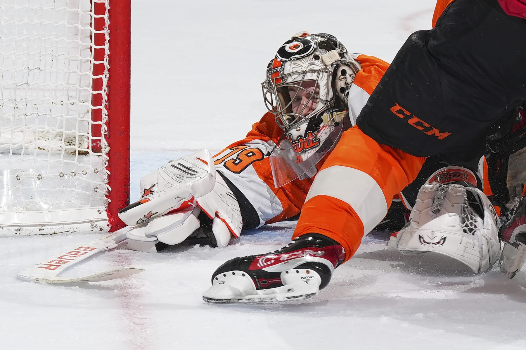 PHILADELPHIA, PA - MARCH 25: Carter Hart #79 of the Philadelphia Flyers covers up the puck against the Detroit Red Wings in the third period at the Wells Fargo Center on March 25, 2023 in Philadelphia, Pennsylvania. The Flyers defeated the Red Wings 3-0. (Photo by Mitchell Leff/Getty Images)