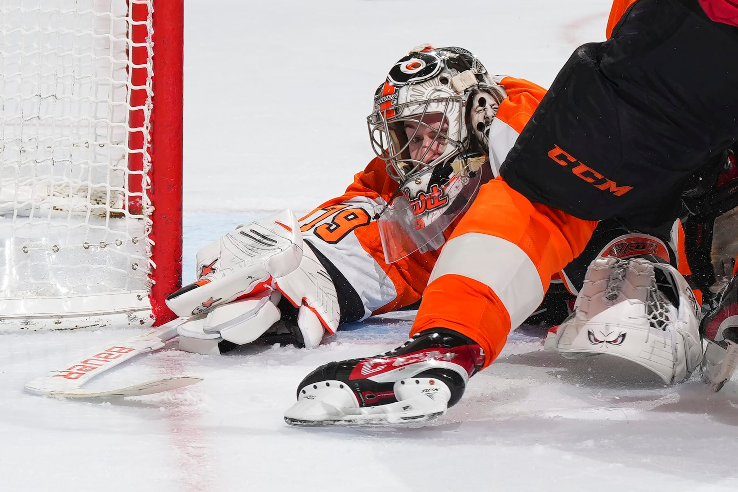 PHILADELPHIA, PA - MARCH 25: Carter Hart #79 of the Philadelphia Flyers covers up the puck against the Detroit Red Wings in the third period at the Wells Fargo Center on March 25, 2023 in Philadelphia, Pennsylvania. The Flyers defeated the Red Wings 3-0. (Photo by Mitchell Leff/Getty Images)