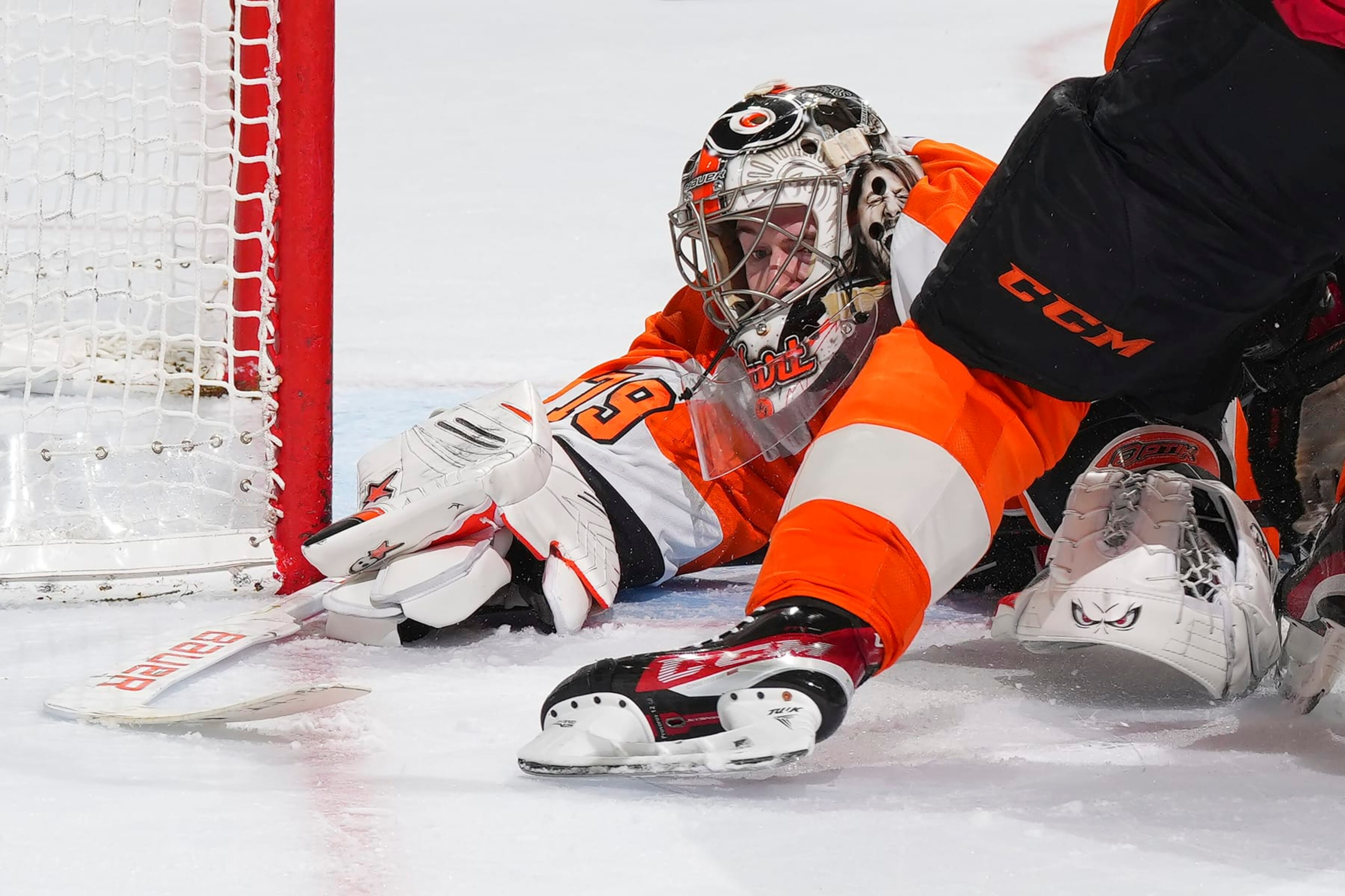 PHILADELPHIA, PA - MARCH 25: Carter Hart #79 of the Philadelphia Flyers covers up the puck against the Detroit Red Wings in the third period at the Wells Fargo Center on March 25, 2023 in Philadelphia, Pennsylvania. The Flyers defeated the Red Wings 3-0. (Photo by Mitchell Leff/Getty Images)