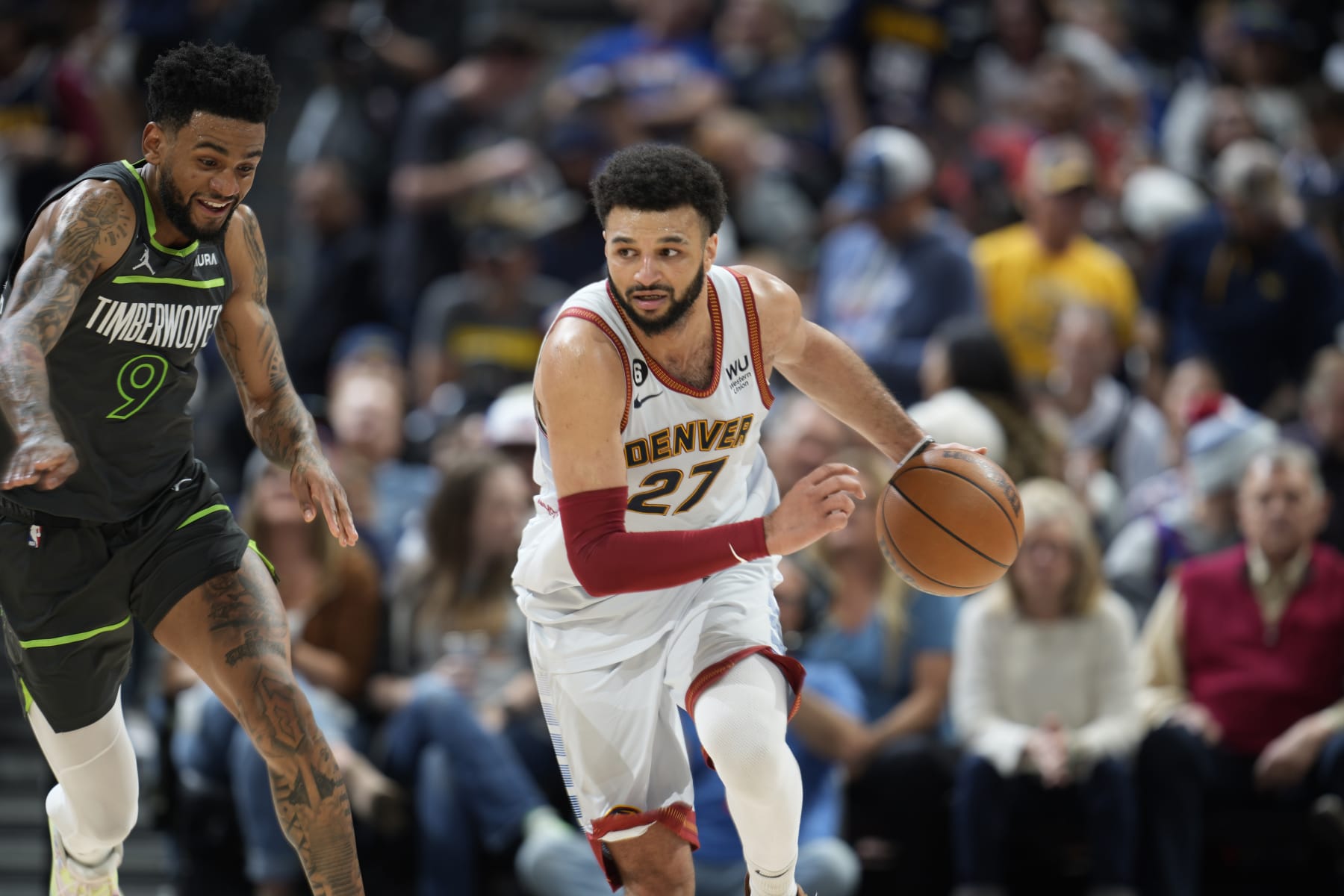 Denver Nuggets guard Jamal Murray (27) and Minnesota Timberwolves guard Nickeil Alexander-Walker (9) in the second half of Game 5 of an NBA basketball first-round playoff series Tuesday, April 25, 2023, in Denver. (AP Photo/David Zalubowski)