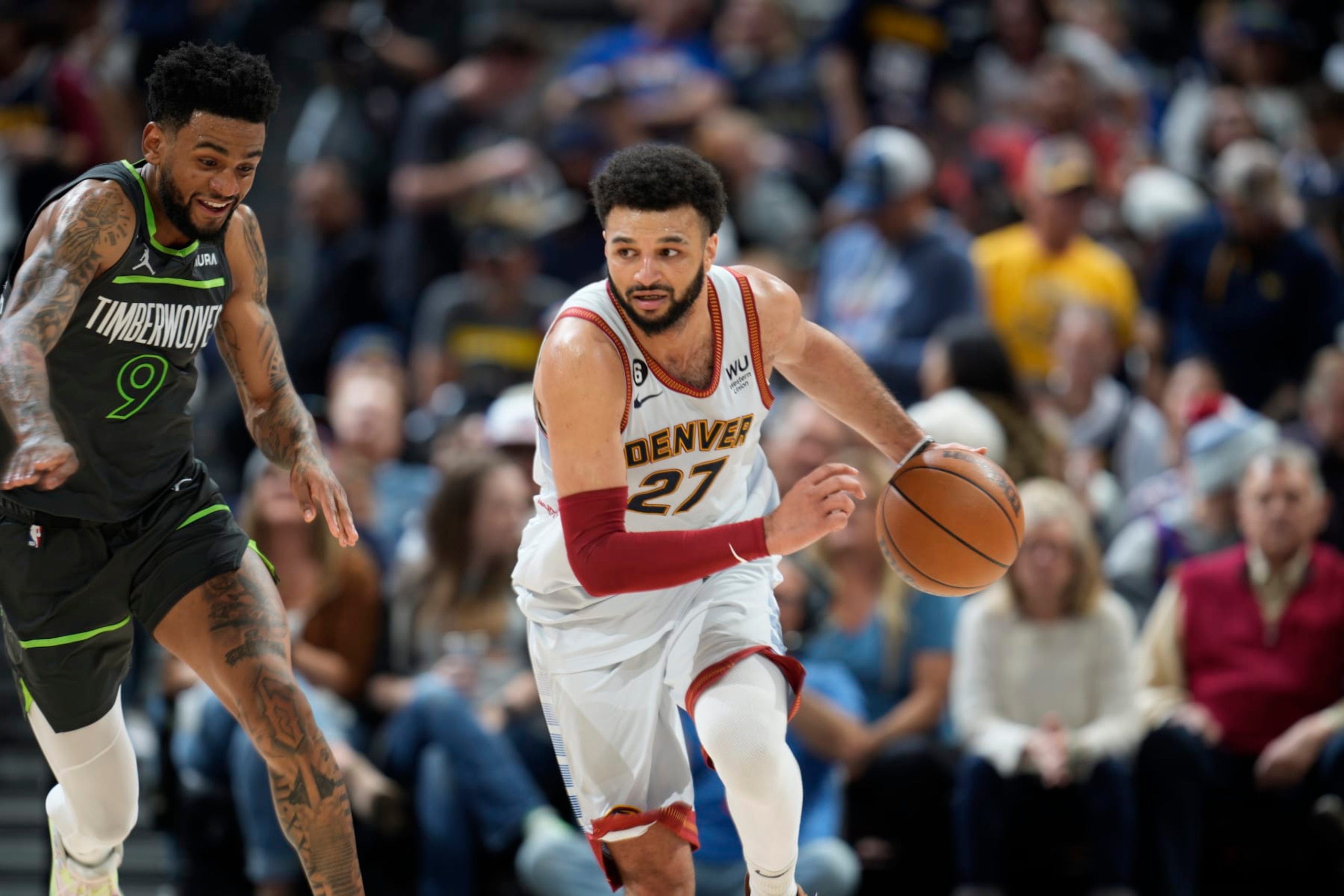 Denver Nuggets guard Jamal Murray (27) and Minnesota Timberwolves guard Nickeil Alexander-Walker (9) in the second half of Game 5 of an NBA basketball first-round playoff series Tuesday, April 25, 2023, in Denver. (AP Photo/David Zalubowski)