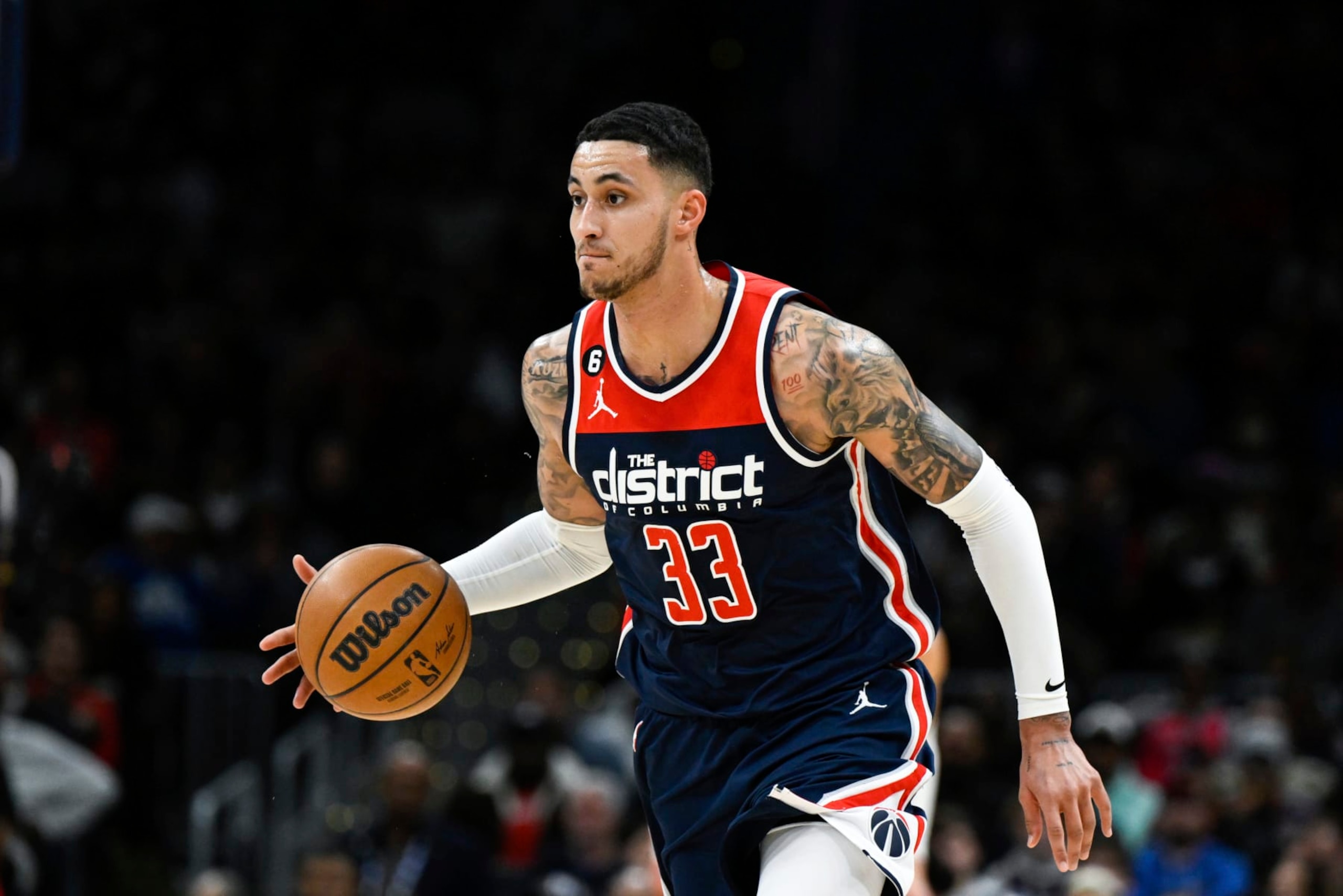Washington Wizards forward Kyle Kuzma (33) handles the ball during the first half of an NBA basketball game against the Toronto Raptors, Saturday, March. 4, 2023, in Washington. (AP Photo/Terrance Williams)
