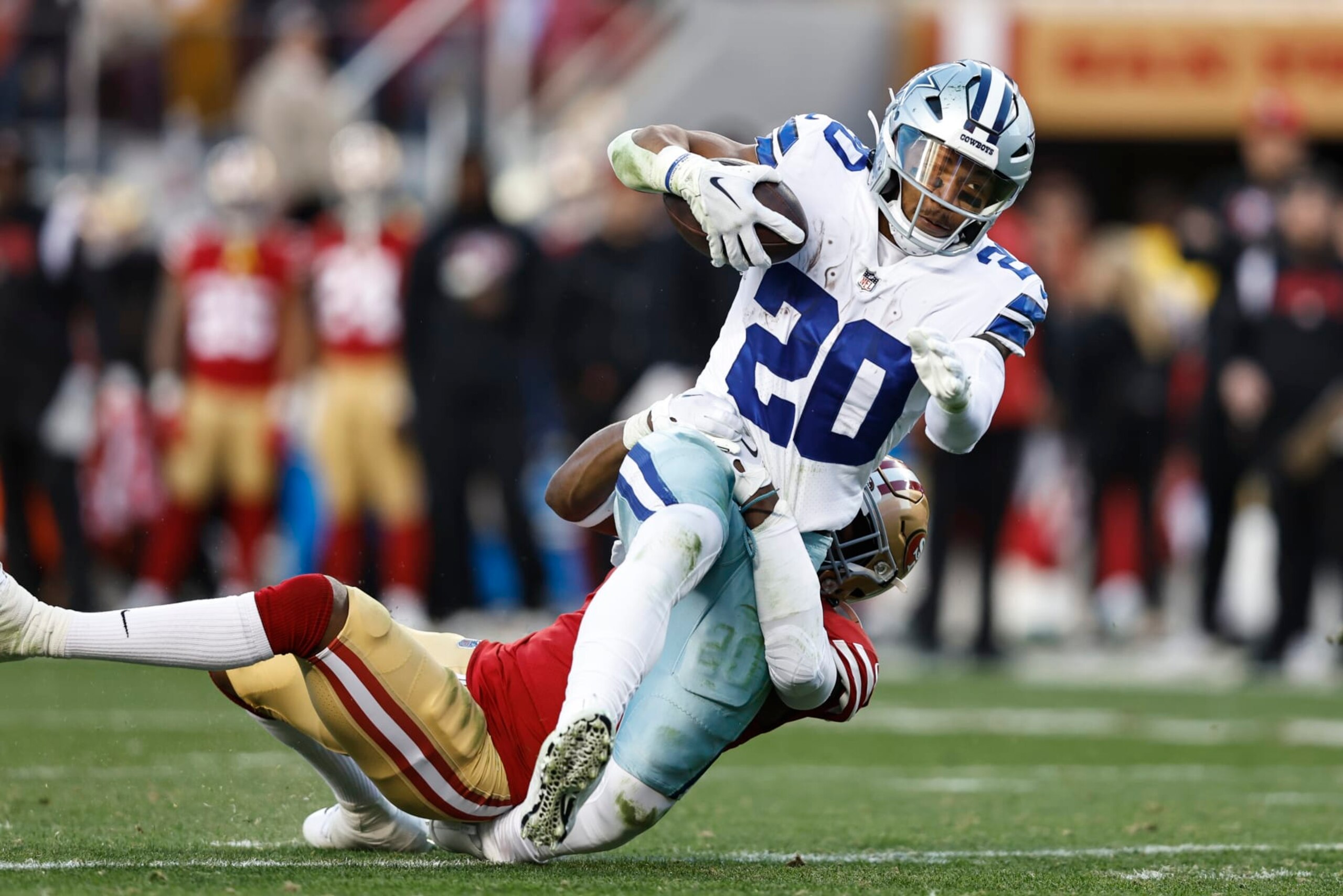 SANTA CLARA, CALIFORNIA - JANUARY 22: Tony Pollard #20 of the Dallas Cowboys is tackled by Jimmie Ward #1 of the San Francisco 49ers as he runs with the ball and gets injured during an NFL divisional round playoff football game between the San Francisco 49ers and the Dallas Cowboys at Levi's Stadium on January 22, 2023 in Santa Clara, California. (Photo by Michael Owens/Getty Images) SANTA CLARA, CALIFORNIA - JANUARY 22: Tony Pollard #20 of the Dallas Cowboys is tackled by Jimmie Ward #1 of the San Francisco 49ers as he runs with the ball and gets injured during an NFL divisional round playoff football game between the San Francisco 49ers and the Dallas Cowboys at Levi's Stadium on January 22, 2023 in Santa Clara, California. (Photo by Michael Owens/Getty Images)