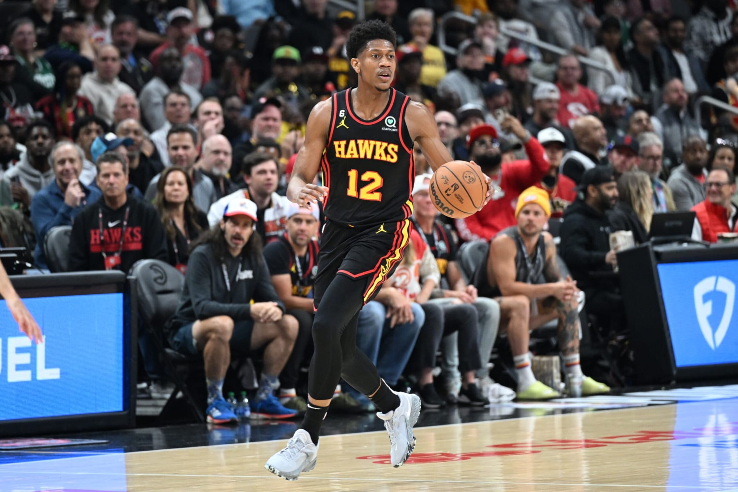 ATLANTA, GA - APRIL 27: De'Andre Hunter #12 of the Atlanta Hawks dribbles the ball during the game against the Boston Celtics during Round 1 Game 6 of the 2023 NBA Playoffs on April 27, 2023 at State Farm Arena in Atlanta, Georgia.  NOTE TO USER: User expressly acknowledges and agrees that, by downloading and/or using this Photograph, user is consenting to the terms and conditions of the Getty Images License Agreement. Mandatory Copyright Notice: Copyright 2023 NBAE (Photo by Adam Hagy/NBAE via Getty Images)