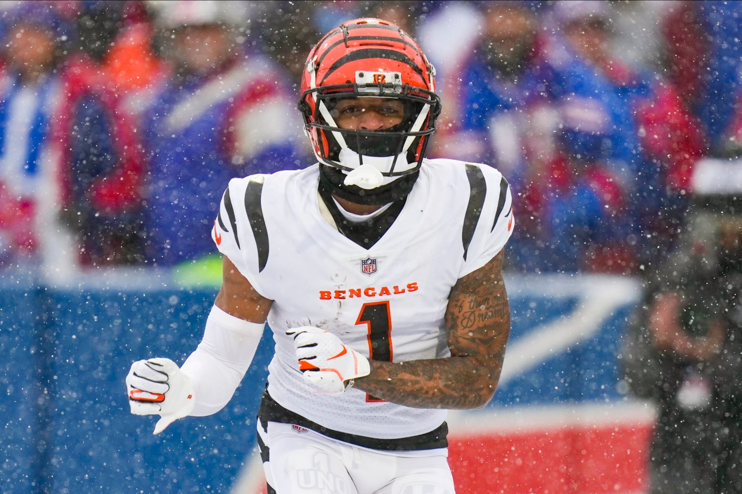 Cincinnati Bengals wide receiver Ja'Marr Chase (1) reacts after making a touchdown catch against the Buffalo Bills during the first quarter of an NFL division round football game, Sunday, Jan. 22, 2023, in Orchard Park, N.Y. (AP Photo/Seth Wenig)