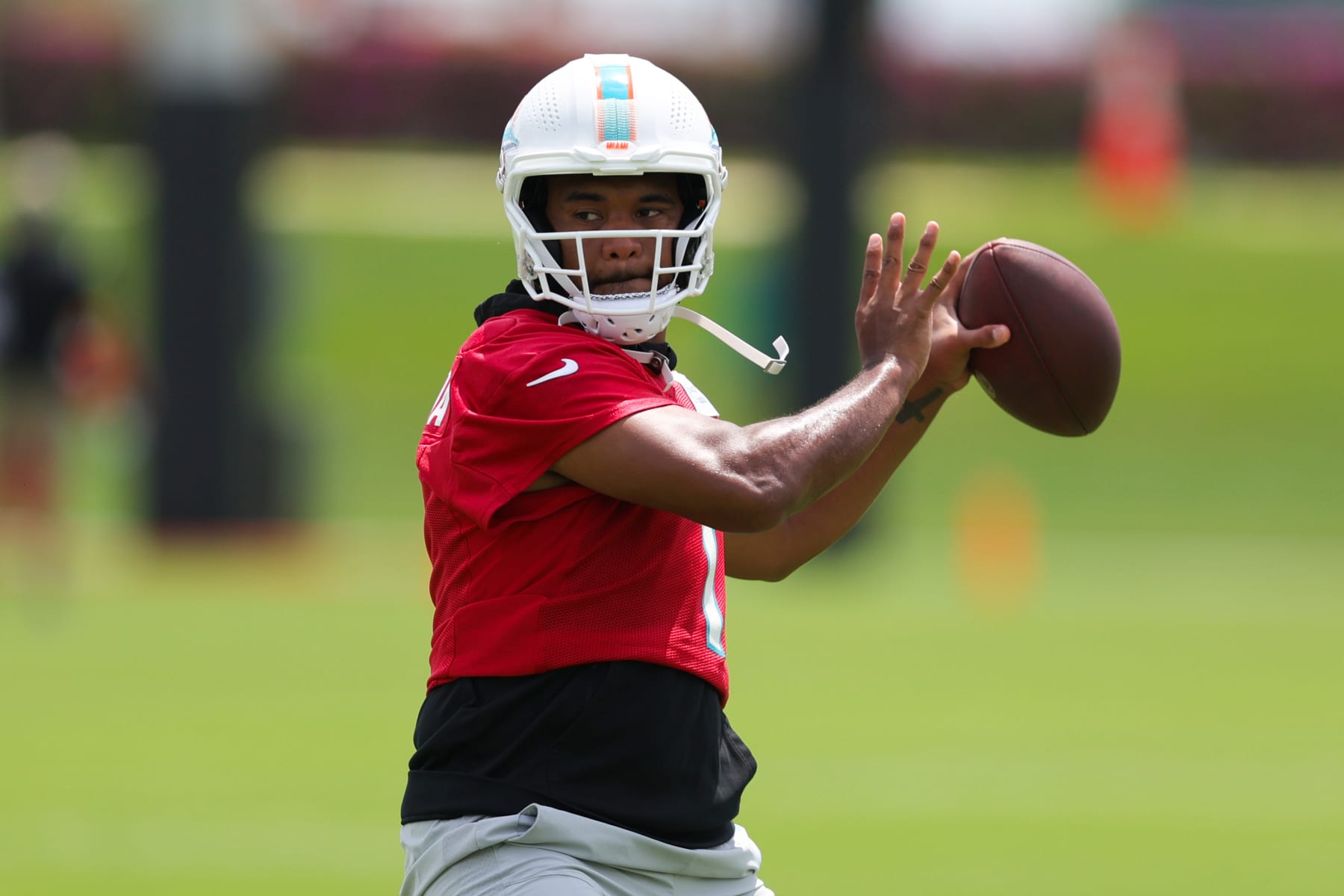 MIAMI GARDENS, FLORIDA - JUNE 08: Tua Tagovailoa #1 of the Miami Dolphins throws a pass during practice at Baptist Health Training Complex on June 08, 2023 in Miami Gardens, Florida. (Photo by Megan Briggs/Getty Images)