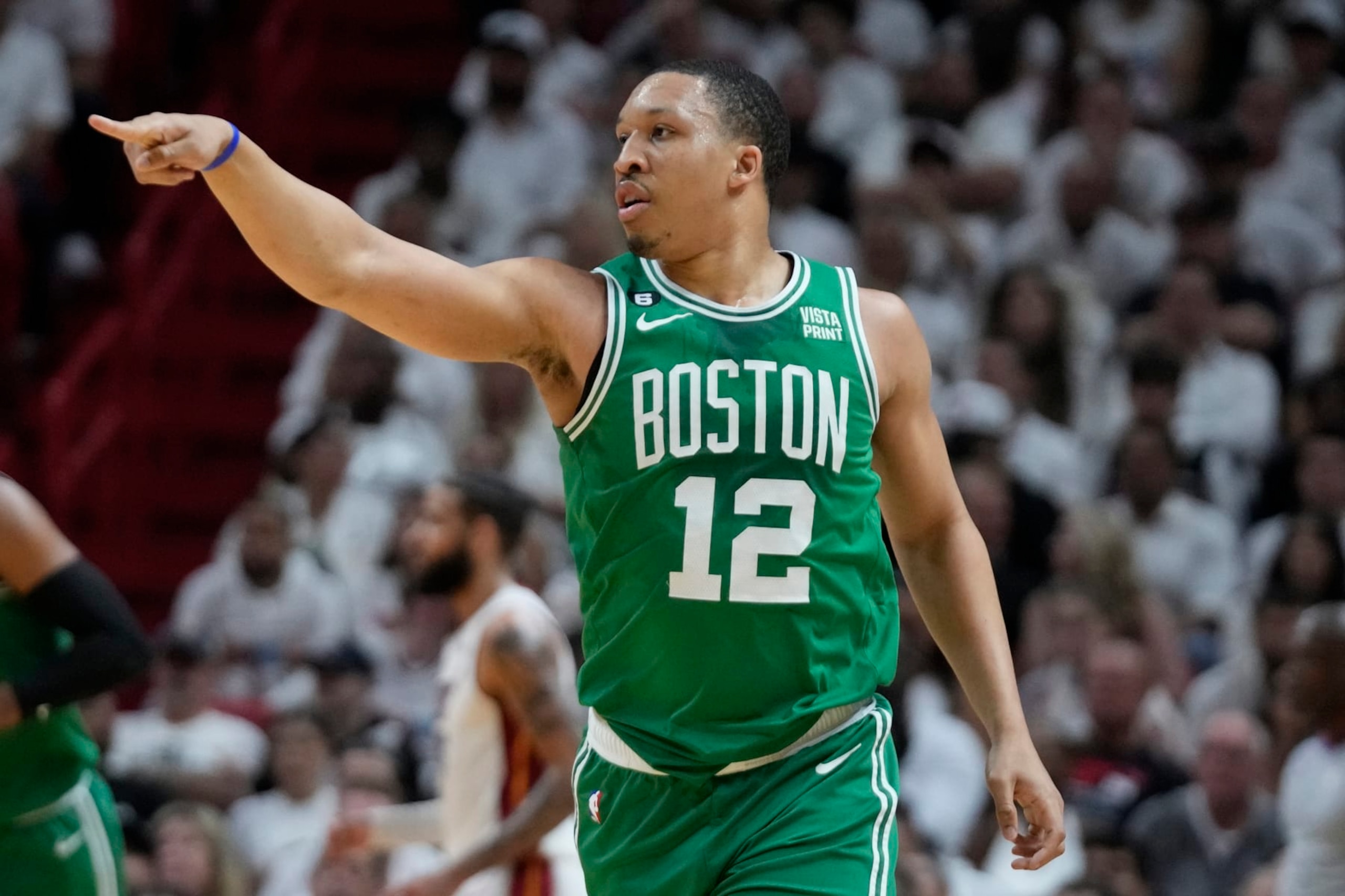 Boston Celtics forward Grant Williams (12) gestures to his teammates during the first half of Game 4 during the NBA basketball playoffs Eastern Conference finals against the Miami Heat, Tuesday, May 23, 2023, in Miami. (AP Photo/Wilfredo Lee)