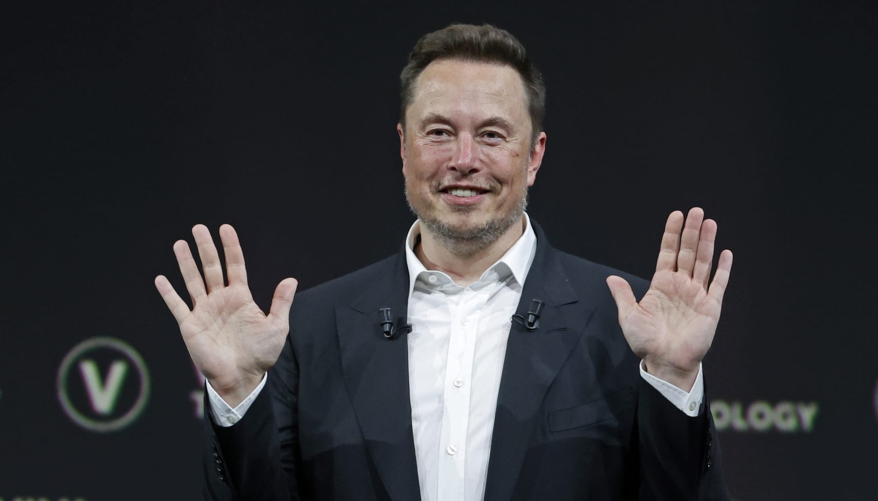 PARIS, FRANCE - JUNE 16: Chief Executive Officer of SpaceX and Tesla and owner of Twitter, Elon Musk gestures as he attends the Viva Technology conference dedicated to innovation and startups at the Porte de Versailles exhibition centre on June 16, 2023 in Paris, France. Elon Musk is visiting Paris for the VivaTech show where he gives a conference in front of 4,000 technology enthusiasts. He also took the opportunity to meet Bernard Arnaud, CEO of LVMH and the French President. Emmanuel Macron, who has already met Elon Musk twice in recent months, hopes to convince him to set up a Tesla battery factory in France, his pioneer company in electric cars. (Photo by Chesnot/Getty Images)