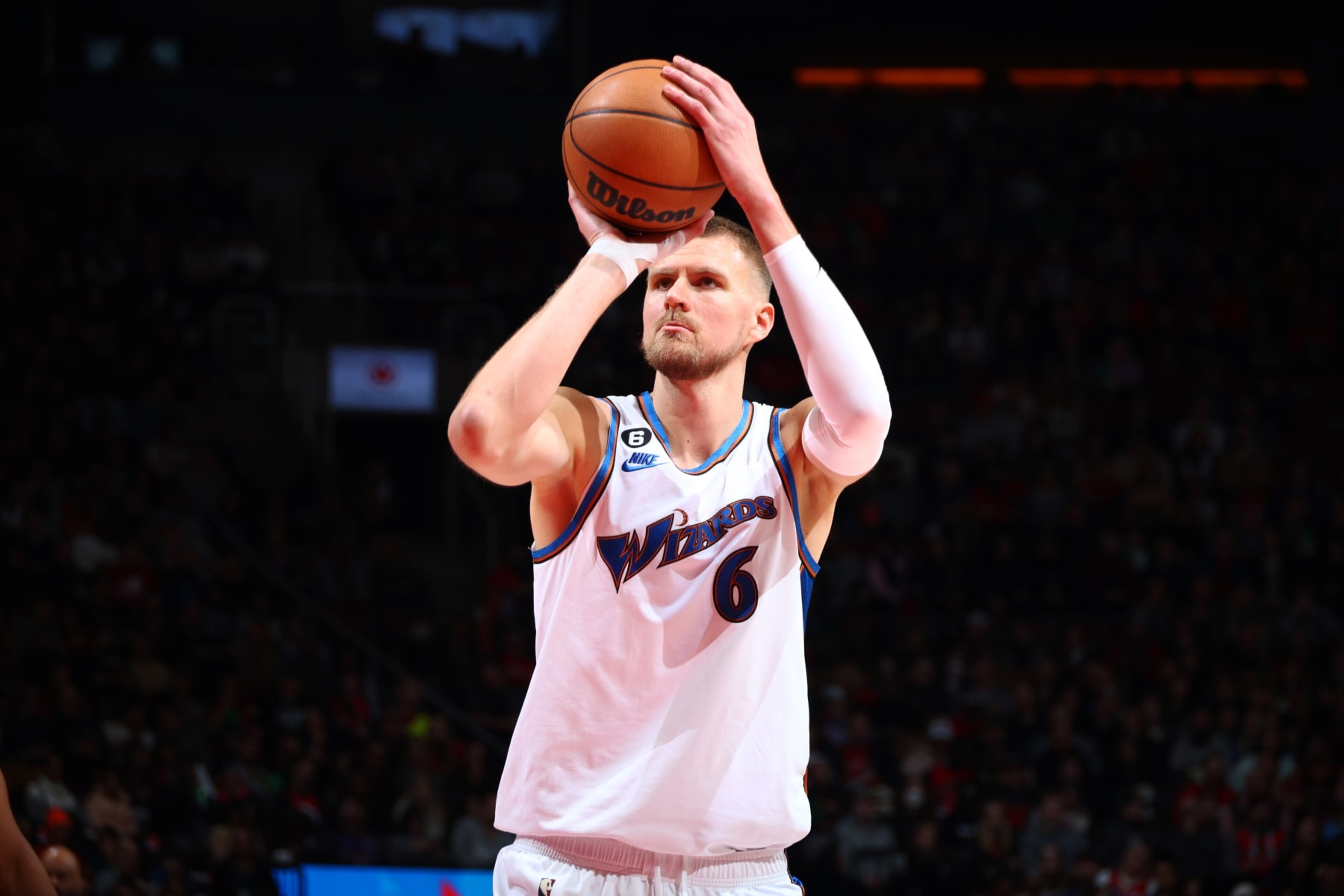 TORONTO, CANADA - MARCH 26: Kristaps Porzingis #6 of the Washington Wizards shoots the ball during the game against the Toronto Raptors on March 26, 2023 at the Scotiabank Arena in Toronto, Ontario, Canada.  NOTE TO USER: User expressly acknowledges and agrees that, by downloading and or using this Photograph, user is consenting to the terms and conditions of the Getty Images License Agreement.  Mandatory Copyright Notice: Copyright 2023 NBAE (Photo by Vaughn Ridley/NBAE via Getty Images)