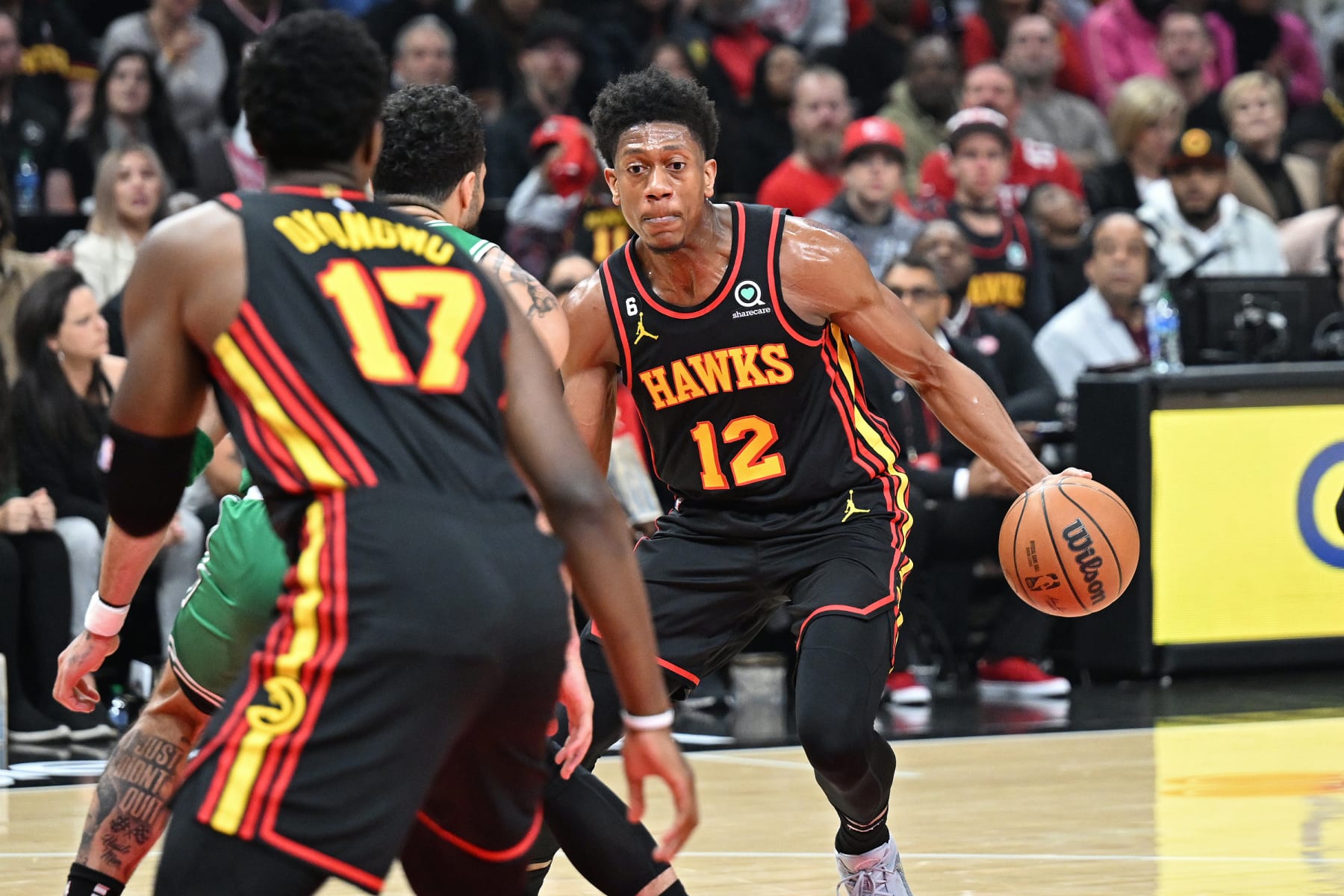 ATLANTA, GA - APRIL 27: De'Andre Hunter #12 of the Atlanta Hawks dribbles the ball during Round 1 Game 6 of the 2023 NBA Playoffs against the Boston Celtics on April 27, 2023 at State Farm Arena in Atlanta, Georgia.  NOTE TO USER: User expressly acknowledges and agrees that, by downloading and/or using this Photograph, user is consenting to the terms and conditions of the Getty Images License Agreement. Mandatory Copyright Notice: Copyright 2023 NBAE (Photo by Adam Hagy/NBAE via Getty Images)