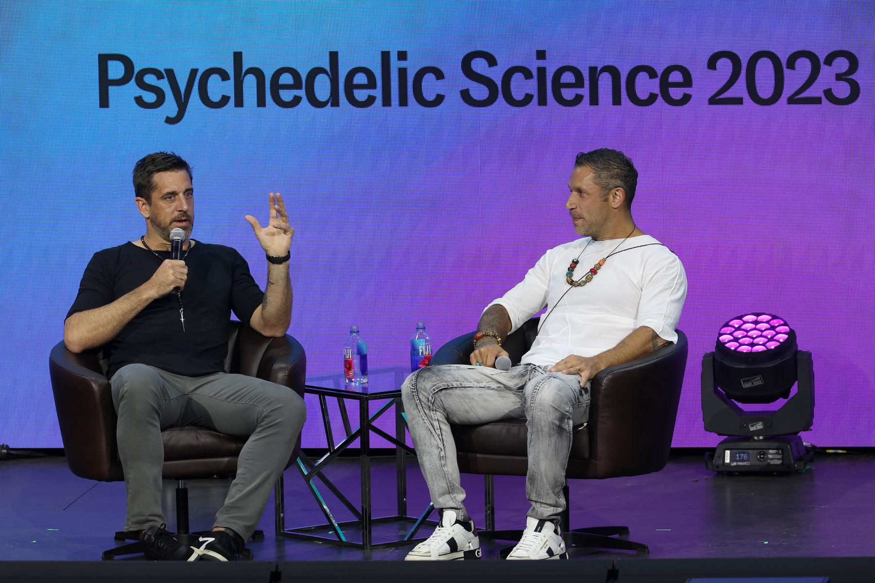 DENVER, COLORADO - JUNE 21: NFL Quarterback Aaron Rodgers participates in a talk with author Aubrey Marcus as part of Psychedelic Science 2023 in the Bellcor Theatre of the Colorado Convention Center on June 21, 2023 in Denver, Colorado. (Photo by Matthew Stockman/Getty Images)