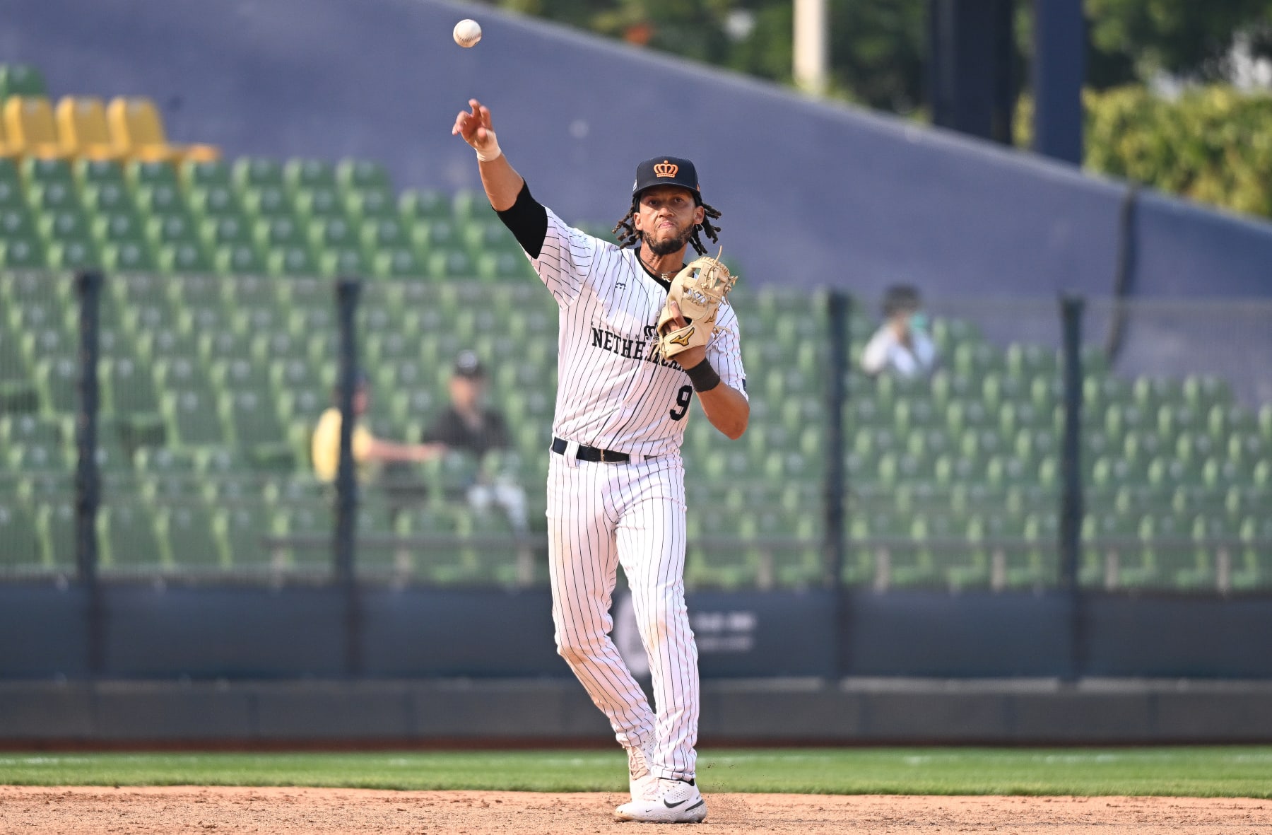 TAICHUNG, TAIWAN - MARCH 08: Andrelton Simmons #9 of Team Netherlands throws at the top of the 9th inning during the World Baseball Classic Pool A game between Cuba and Netherlands at Taichung Intercontinental Baseball Stadium on March 08, 2023 in Taichung, Taiwan. (Photo by Gene Wang/Getty Images)