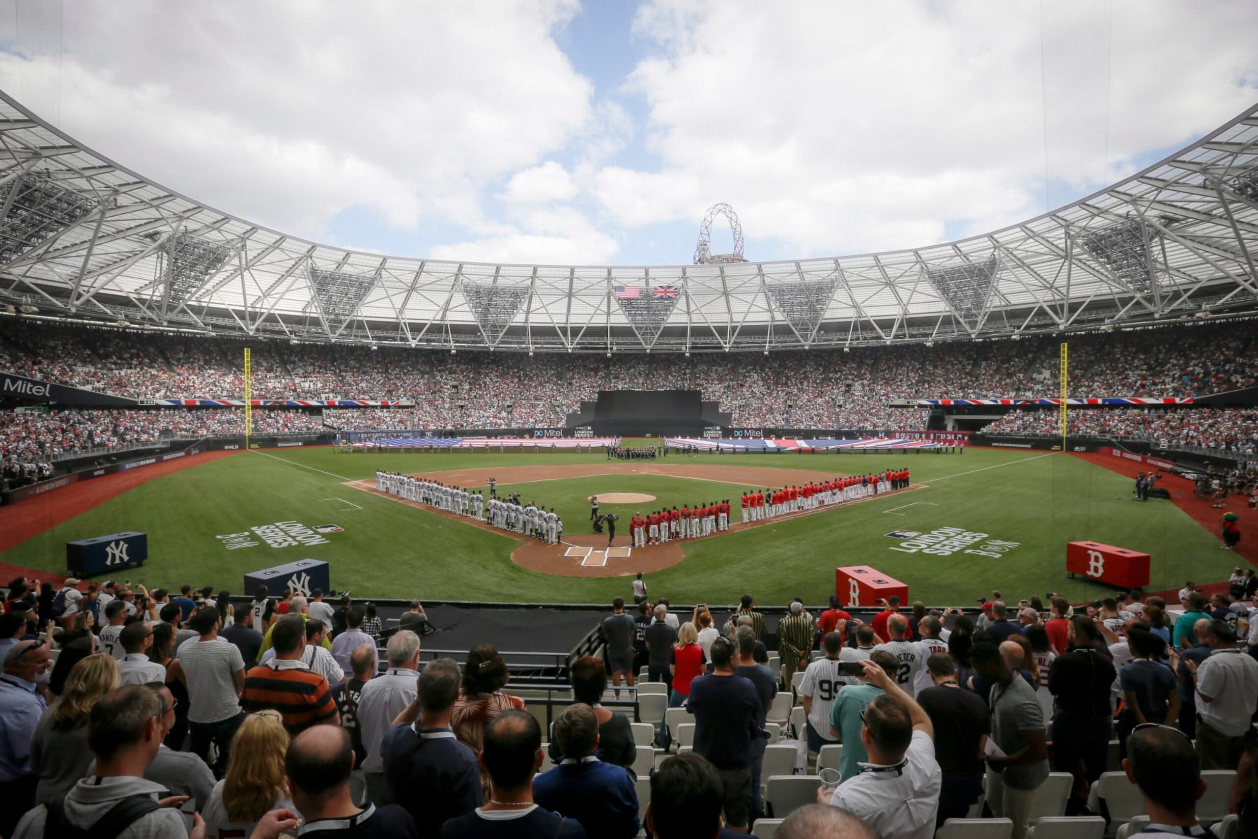 FILE - The New York Yankees, left, and the Boston Red Sox lineup for the national anthem before a baseball game in London on June 30, 2019. Major League Baseball plans to return to London next year for the first time since 2019. The league announced Thursday, Aug. 4, 2022, that the St. Louis Cardinals and Chicago Cubs will play a two-game series on June 24-25, 2023, at London Stadium. (AP Photo/Tim Ireland, File)