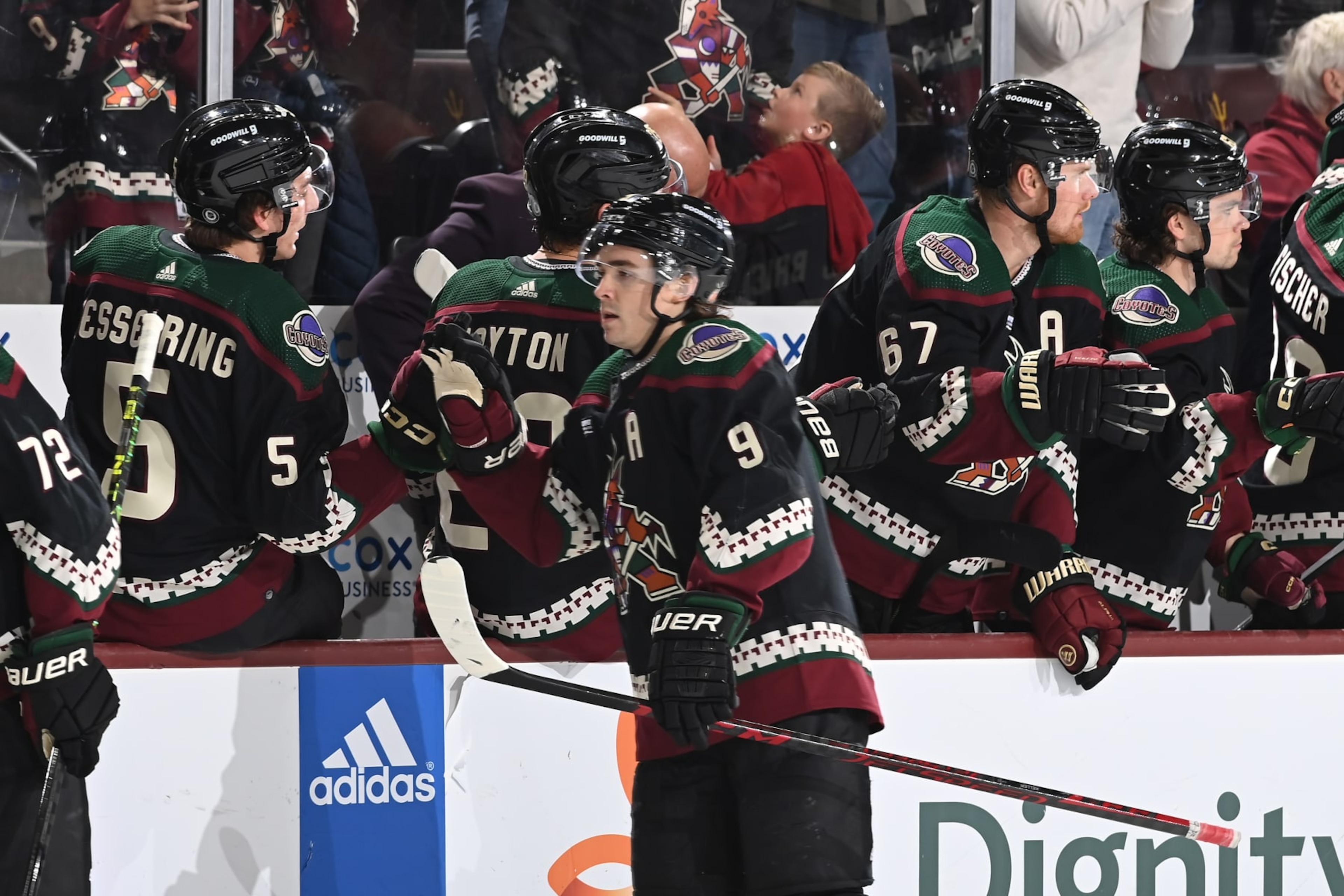 TEMPE, ARIZONA - APRIL 13: Clayton Keller #9 of the Arizona Coyotes celebrates with teammates on the bench after getting an assist on a goal by teammate Travis Boyd #72 against the Vancouver Canucks during the first period at Mullett Arena on April 13, 2023 in Tempe, Arizona. (Photo by Norm Hall/NHLI via Getty Images)