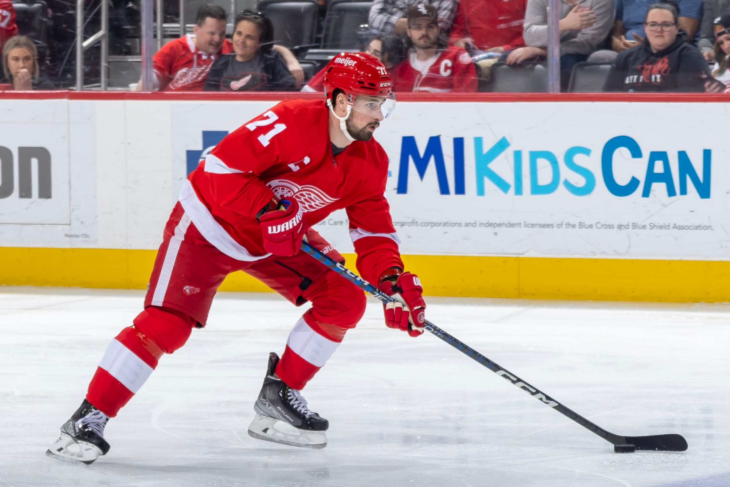 DETROIT, MI - APRIL 10: Dylan Larkin #71 of the Detroit Red Wings skates up ice with the puck against the Dallas Stars during the first period of an NHL game at Little Caesars Arena on April 10, 2023 in Detroit, Michigan. Dallas defeated Detroit 6-1. (Photo by Dave Reginek/NHLI via Getty Images)