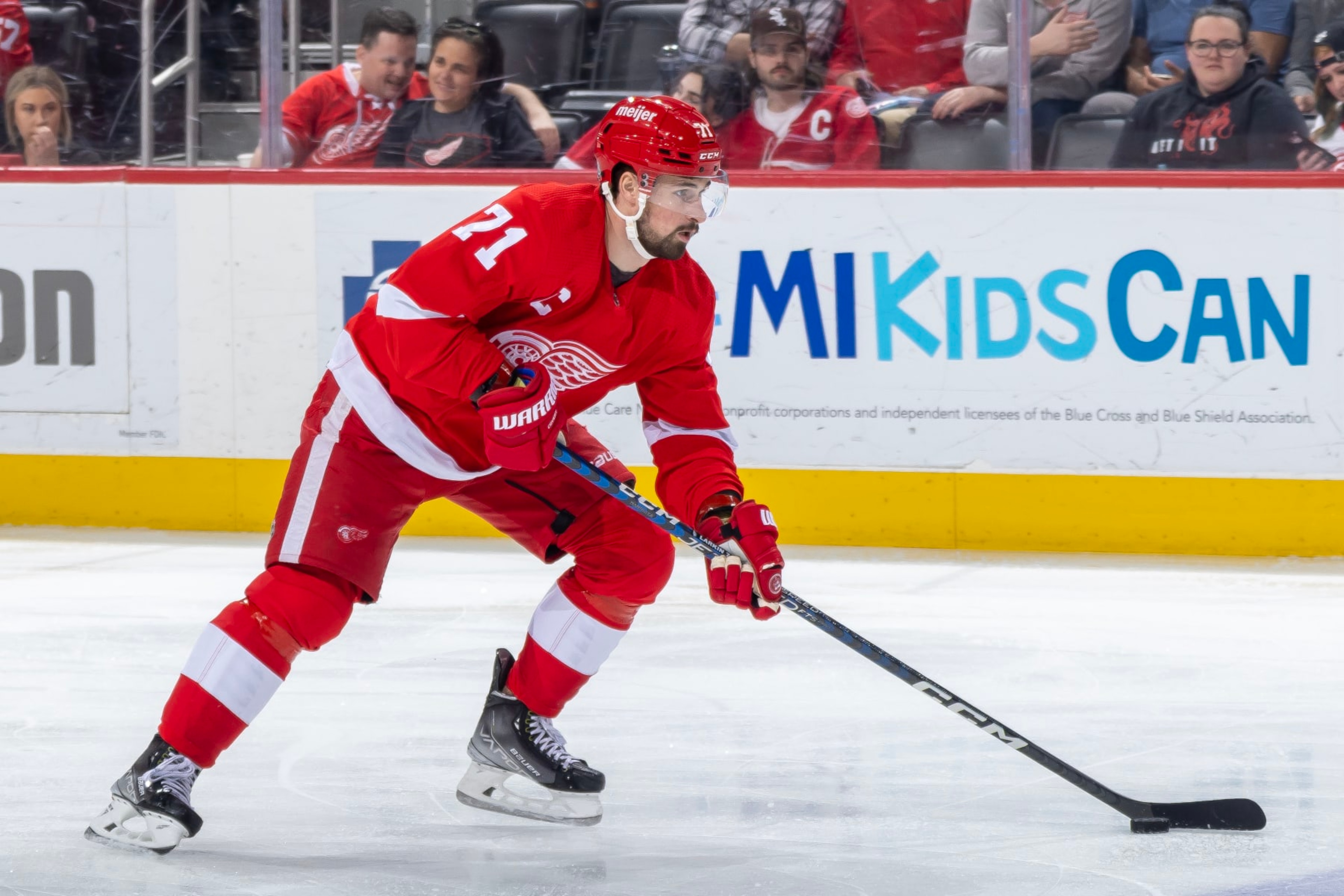 DETROIT, MI - APRIL 10: Dylan Larkin #71 of the Detroit Red Wings skates up ice with the puck against the Dallas Stars during the first period of an NHL game at Little Caesars Arena on April 10, 2023 in Detroit, Michigan. Dallas defeated Detroit 6-1. (Photo by Dave Reginek/NHLI via Getty Images)
