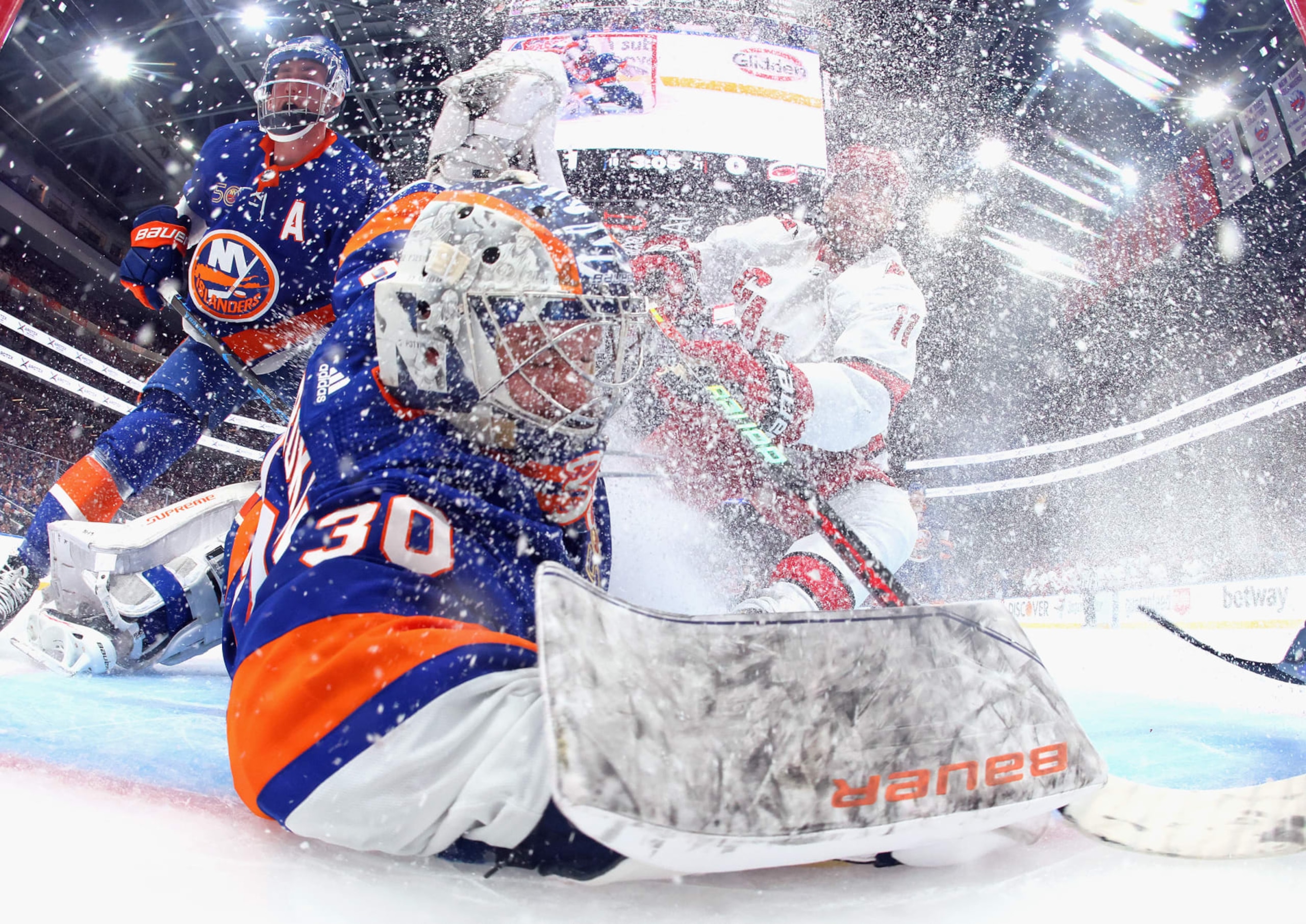 ELMONT, NEW YORK - APRIL 21: Jordan Staal #11 of the Carolina Hurricanes crashes the net as Jesper Fast #71 scores a second period goal against Ilya Sorokin #30 of the New York Islanders during Game Three in the First Round of the 2023 Stanley Cup Playoffs at the UBS Arena on April 21, 2023 in Elmont, New York. (Photo by Bruce Bennett/Getty Images)