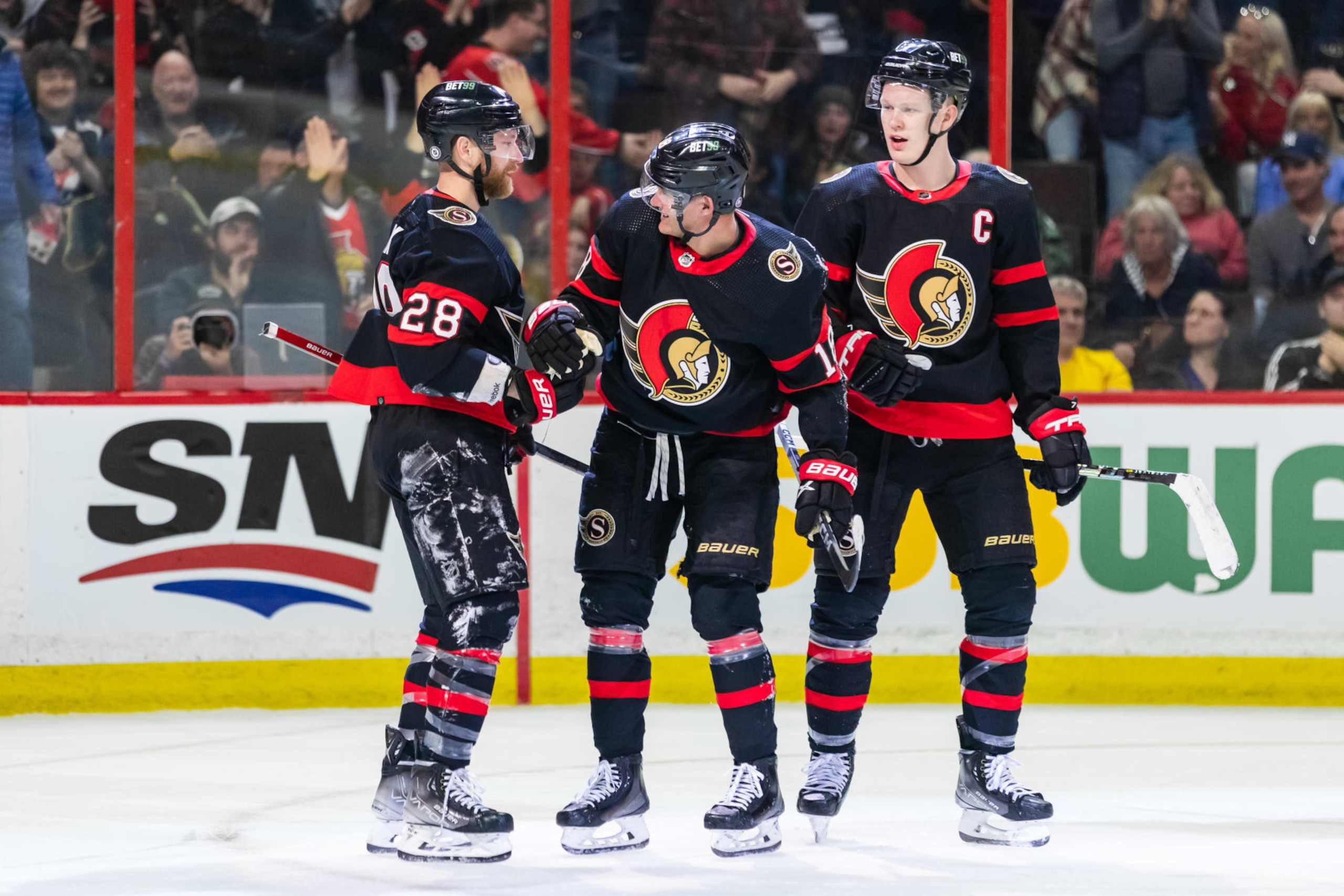 OTTAWA, ON - APRIL 08: Ottawa Senators Center Tim Stutzle (18) celebrates his goal with Right Wing Claude Giroux (28) and Left Wing Brady Tkachuk (7) which was disallowed after review during second period National Hockey League action between the Tampa Bay Lightning and Ottawa Senators on April 8, 2023, at Canadian Tire Centre in Ottawa, ON, Canada. (Photo by Richard A. Whittaker/Icon Sportswire via Getty Images)