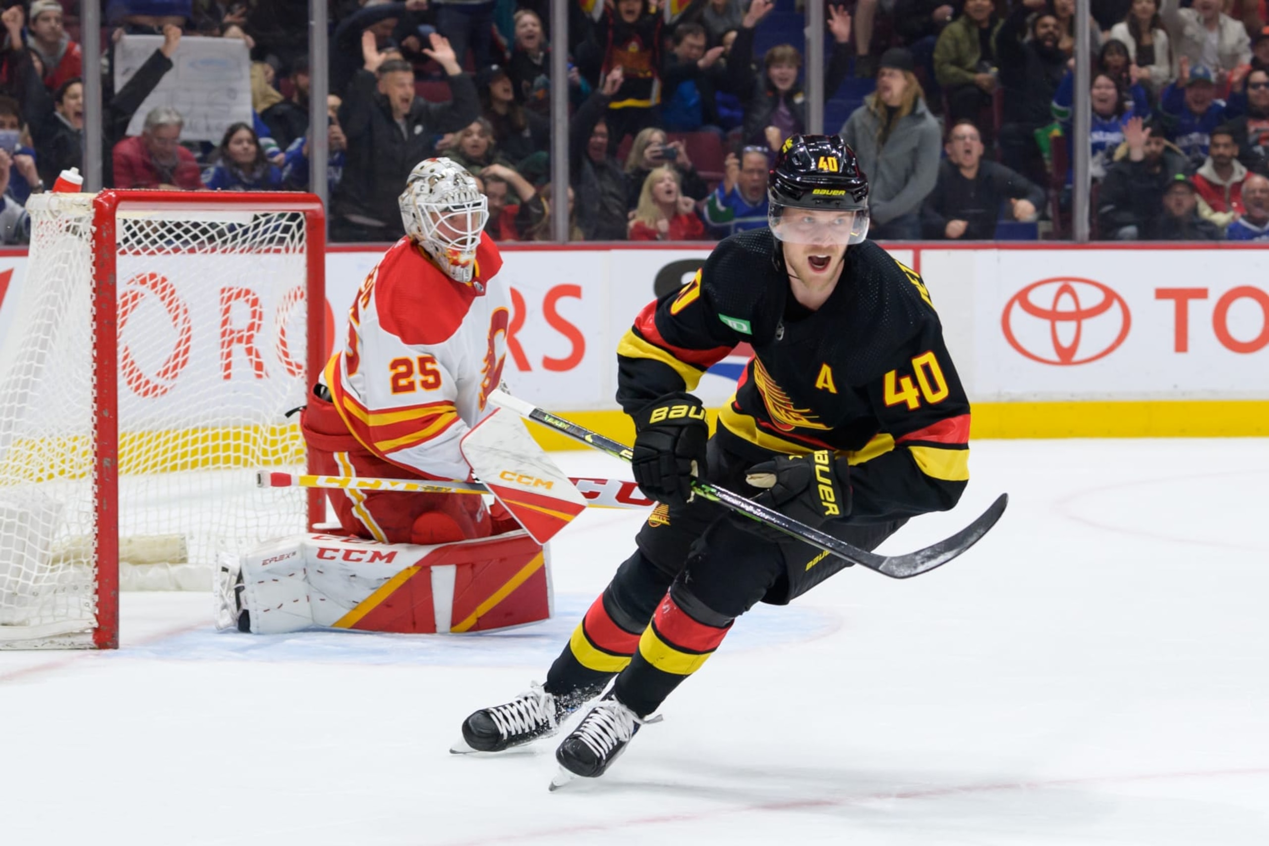 VANCOUVER, CANADA - APRIL 8: Elias Pettersson #40 of the Vancouver Canucks celebrates after scoring a goal against Jacob Markstrom #25 of the Calgary Flames during the first period of their NHL game at Rogers Arena on April 8, 2023 in Vancouver, British Columbia, Canada. (Photo by Derek Cain/Getty Images)
