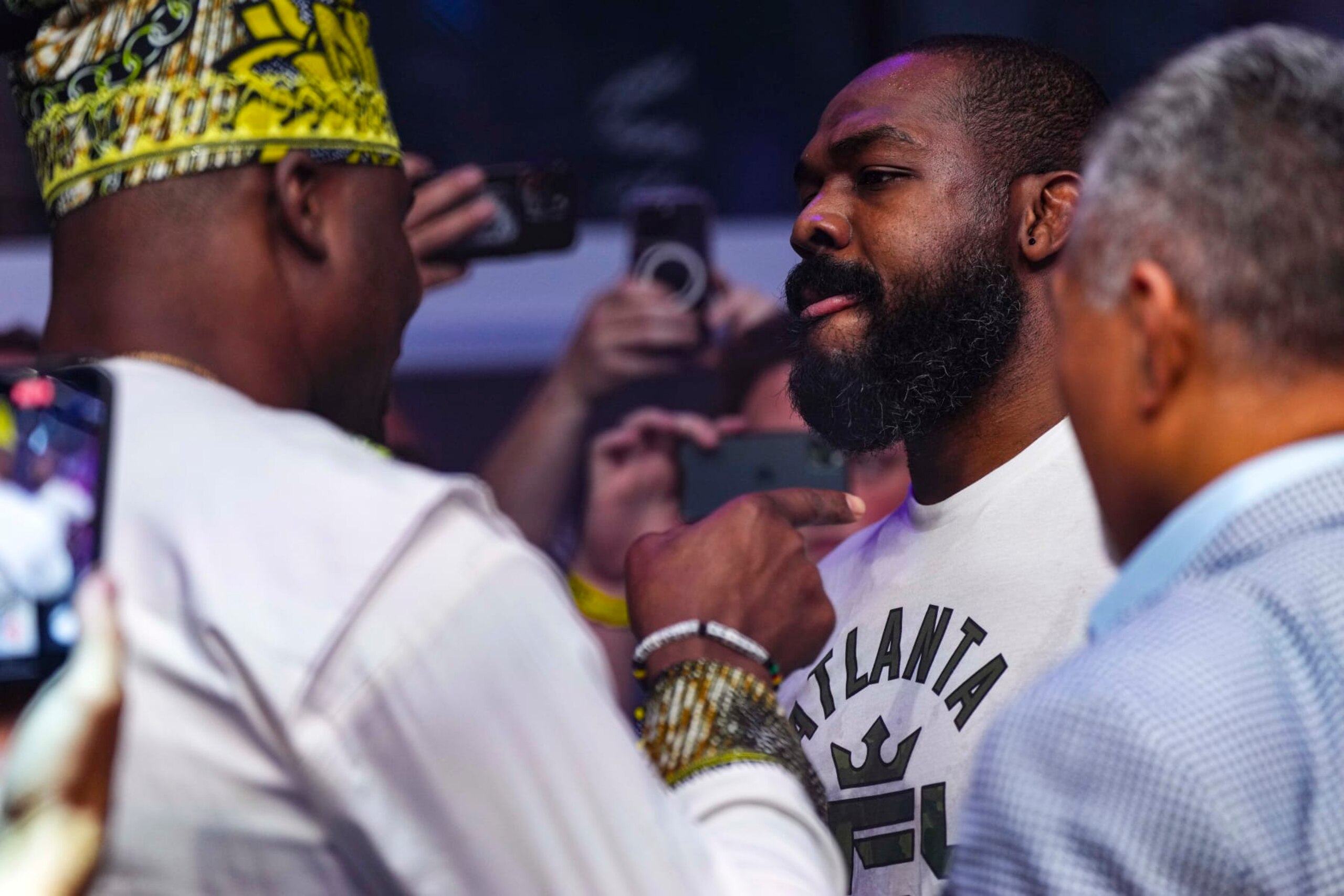 ATLANTA, GA - JUNE 17: Jon Jones has words with Francis Ngannou during PFL 2023 week 5 at OTE Arena on June 17, 2023 in Atlanta, Georgia. (Photo by Cooper Neill/Getty Images)
