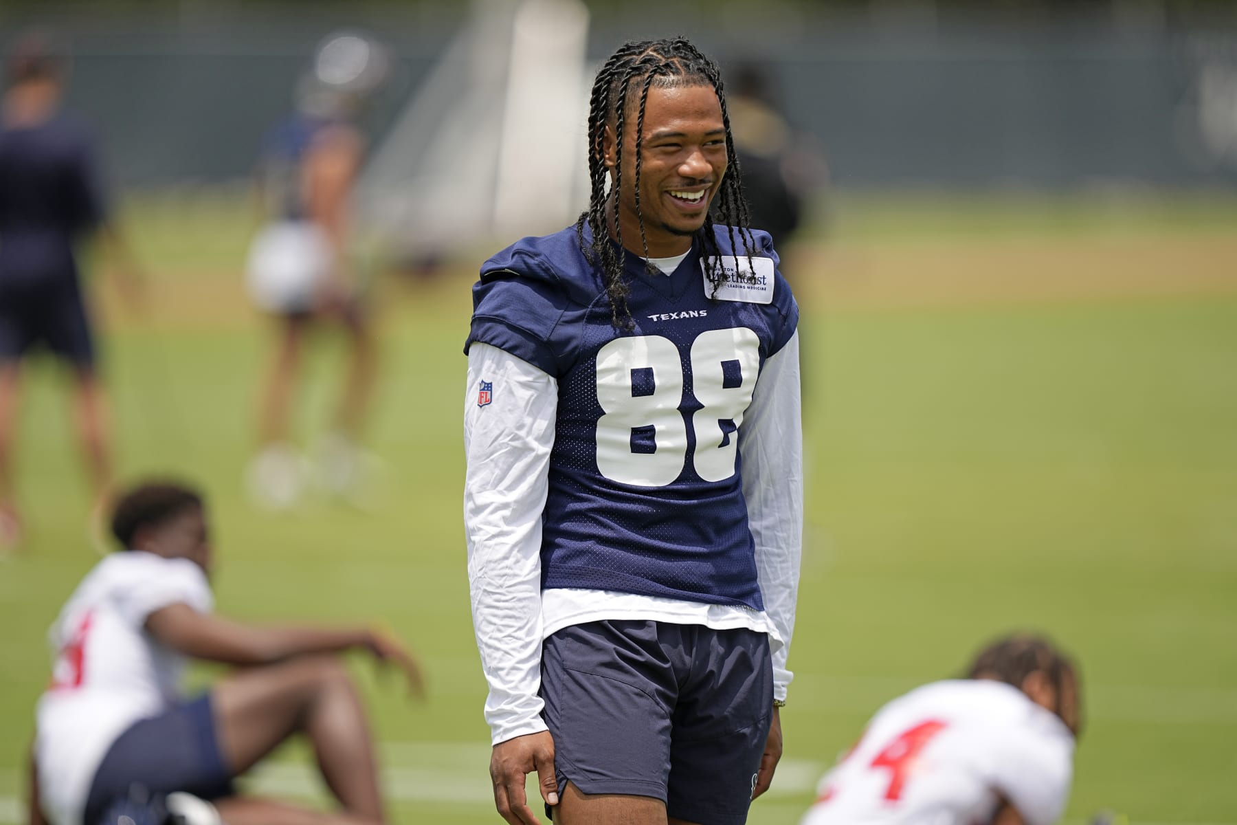 Houston Texans draft pick John Metchie III smiles during an NFL football rookie minicamp practice Friday, May 13, 2022, in Houston. (AP Photo/David J. Phillip)