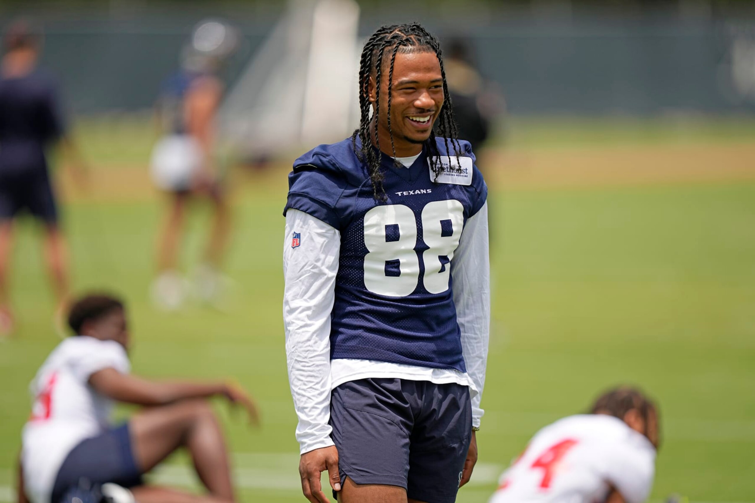 Houston Texans draft pick John Metchie III smiles during an NFL football rookie minicamp practice Friday, May 13, 2022, in Houston. (AP Photo/David J. Phillip)