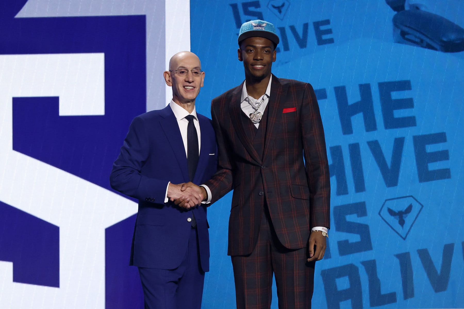 NEW YORK, NEW YORK - JUNE 22: Brandon Miller (R) poses with NBA commissioner Adam Silver (L) after being drafted second overall pick by the Charlotte Hornets during the first round of the 2023 NBA Draft at Barclays Center on June 22, 2023 in the Brooklyn borough of New York City. NOTE TO USER: User expressly acknowledges and agrees that, by downloading and or using this photograph, User is consenting to the terms and conditions of the Getty Images License Agreement. (Photo by Sarah Stier/Getty Images)