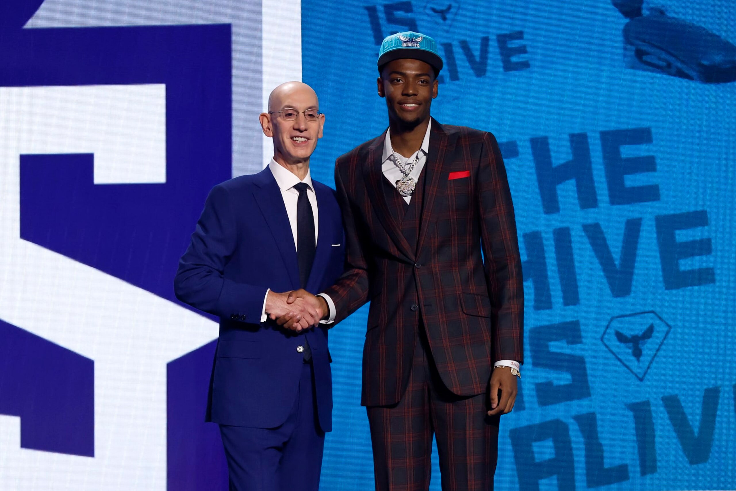 NEW YORK, NEW YORK - JUNE 22: Brandon Miller (R) poses with NBA commissioner Adam Silver (L) after being drafted second overall pick by the Charlotte Hornets during the first round of the 2023 NBA Draft at Barclays Center on June 22, 2023 in the Brooklyn borough of New York City. NOTE TO USER: User expressly acknowledges and agrees that, by downloading and or using this photograph, User is consenting to the terms and conditions of the Getty Images License Agreement. (Photo by Sarah Stier/Getty Images)