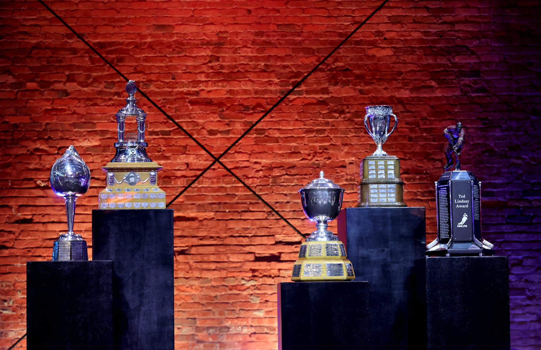 TAMPA, FLORIDA - JUNE 21:  The Hart, Norris, Calder, Vezina trophies and the Ted Lindsay Award are seen on stage during the 2022 NHL Awards at Armature Works on June 21, 2022 in Tampa, Florida. (Photo by Mark LoMoglio/NHLI via Getty Images)