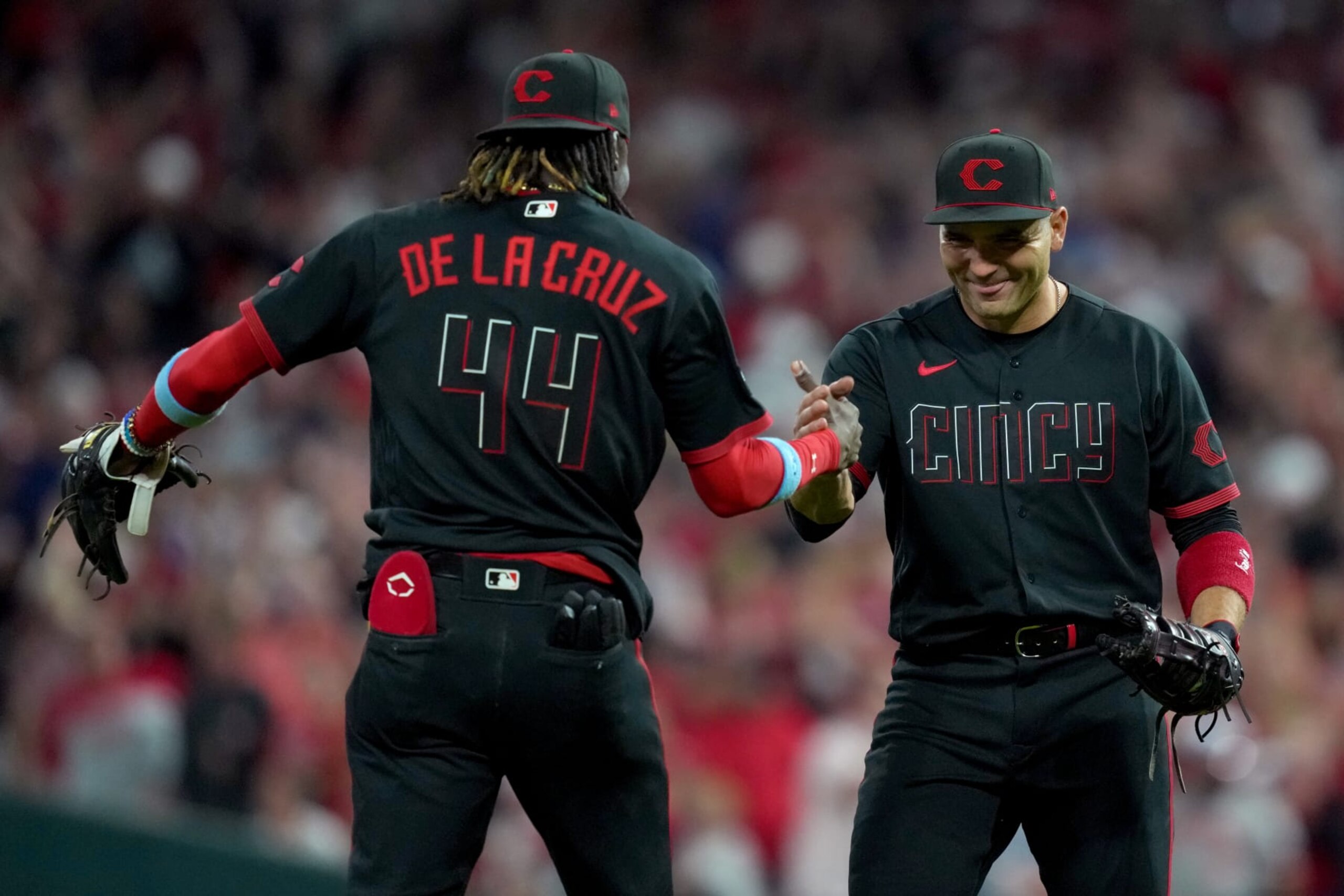 CINCINNATI, OHIO - JUNE 23: Elly De La Cruz #44 and Joey Votto #19 of the Cincinnati Reds celebrate after beating the Atlanta Braves 11-10 at Great American Ball Park on June 23, 2023 in Cincinnati, Ohio. (Photo by Dylan Buell/Getty Images)